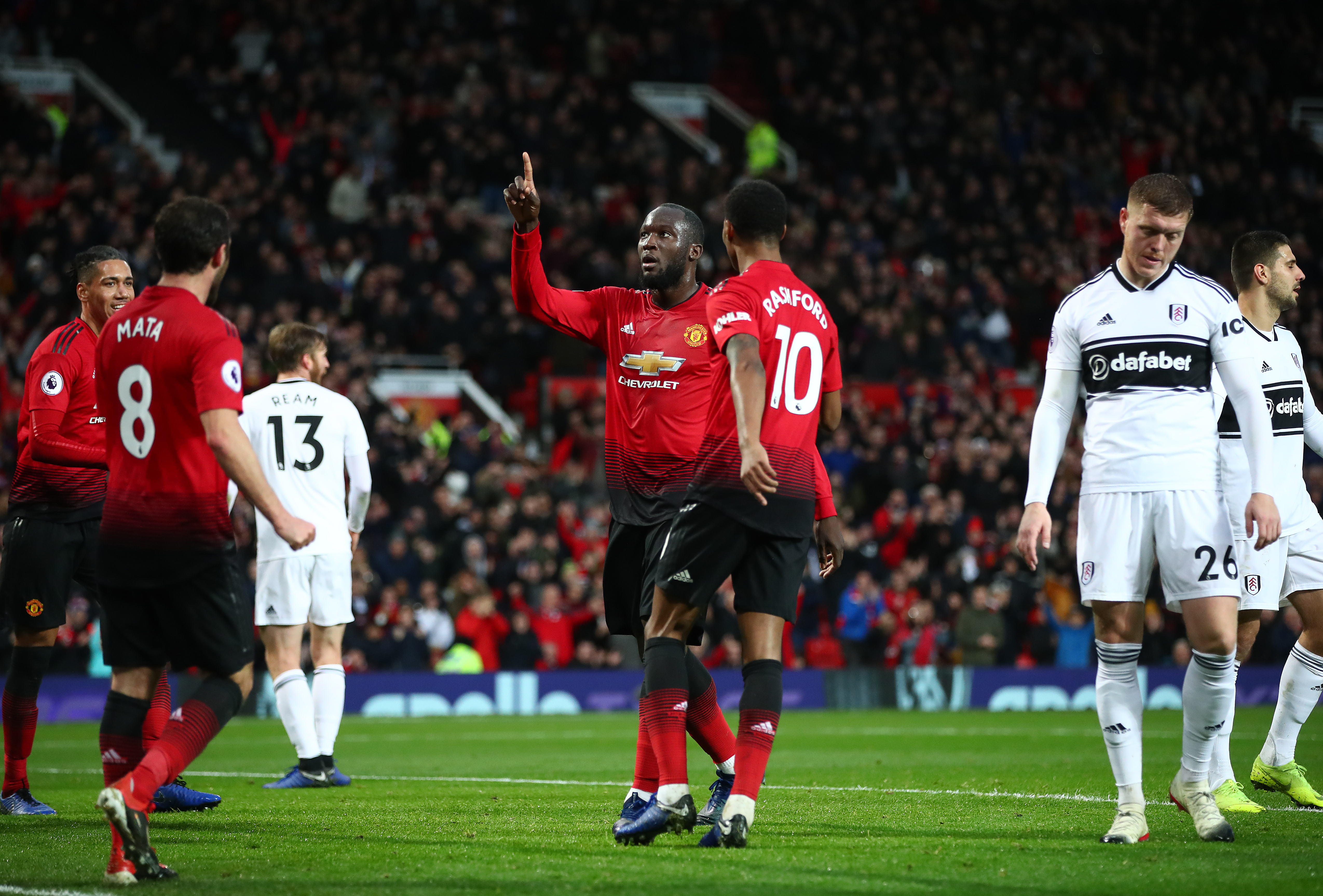 MANCHESTER, ENGLAND - DECEMBER 08: Romelu Lukaku of Manchester United celebrates after scoring his team's third goal with Juan Mata and Marcus Rashford of Manchester United during the Premier League match between Manchester United and Fulham FC at Old Trafford on December 08, 2018 in Manchester, United Kingdom. (Photo by Clive Brunskill/Getty Images)