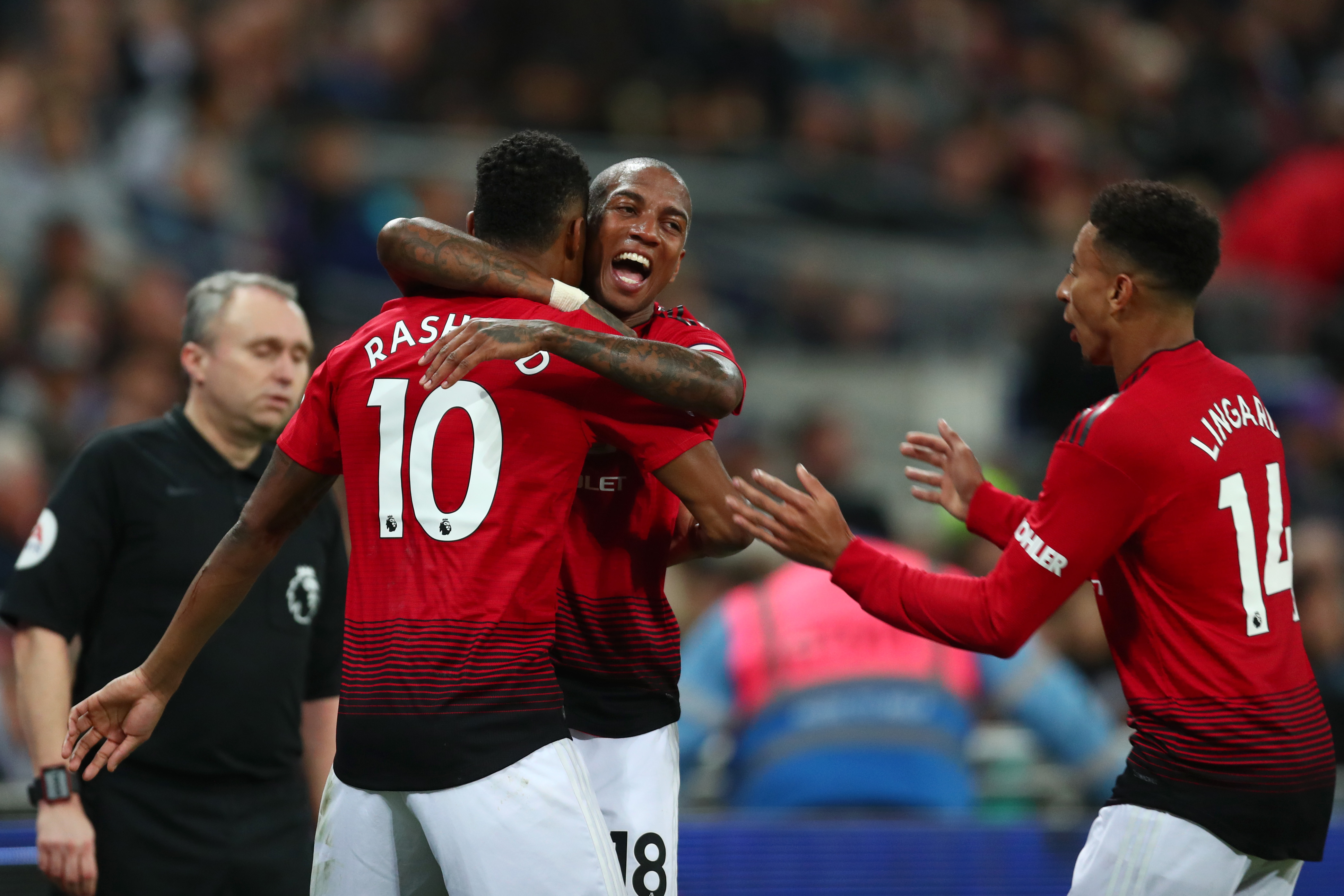 LONDON, ENGLAND - JANUARY 13:  Marcus Rashford of Manchester United celebrates with team mates Ashley Young of Manchester United and Jesse Lingard of Manchester United after scoring their team's first goal during the Premier League match between Tottenham Hotspur and Manchester United at Wembley Stadium on January 13, 2019 in London, United Kingdom.  (Photo by Clive Rose/Getty Images)