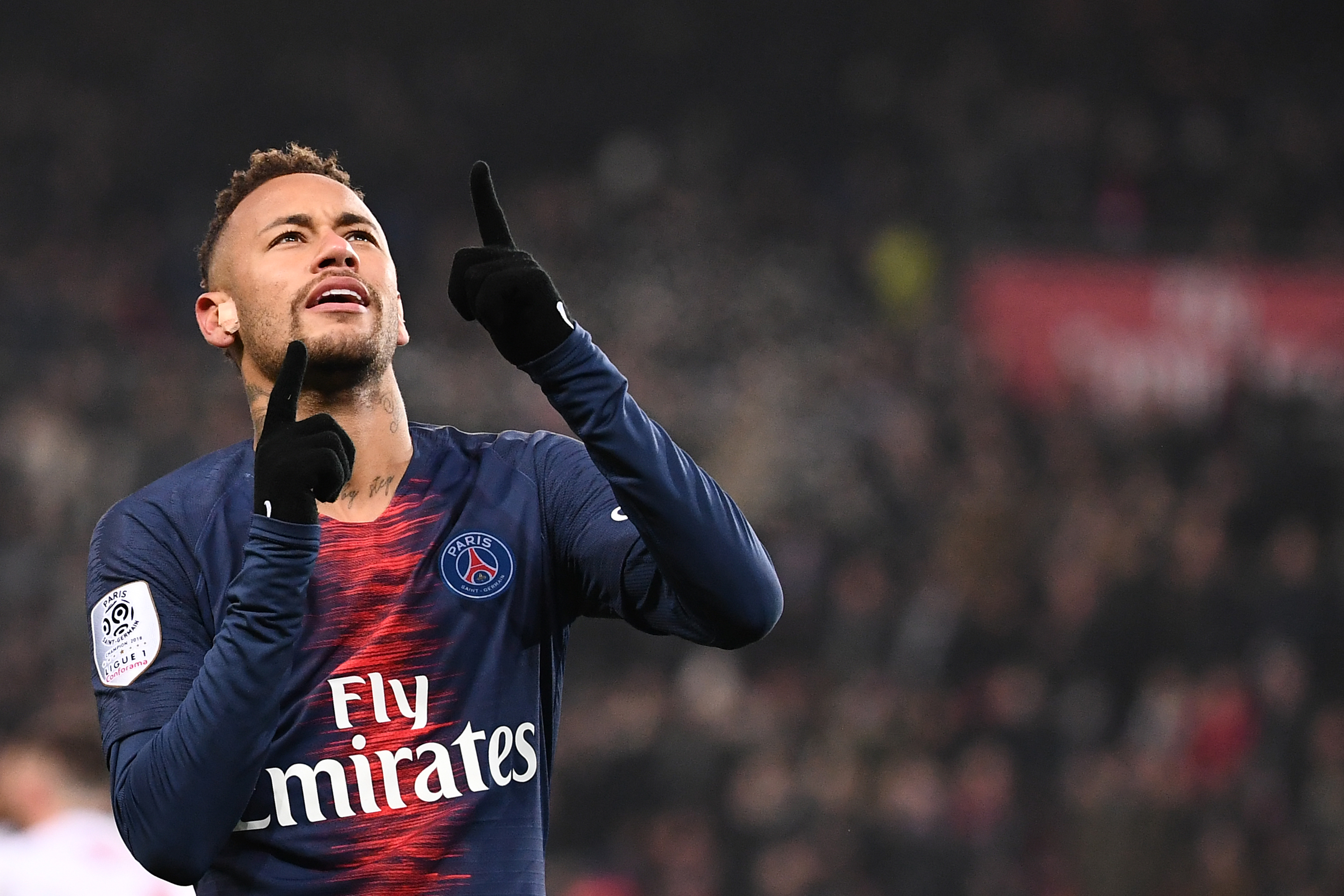 Paris Saint-Germain's Brazilian forward Neymar celebrates after scoring a goal during the French L1 football match Paris Saint-Germain (PSG) vs Guingamp (EAG), on January 19, 2019 at the Parc des Princes stadium in Paris. (Photo by Anne-Christine POUJOULAT / AFP)        (Photo credit should read ANNE-CHRISTINE POUJOULAT/AFP/Getty Images)