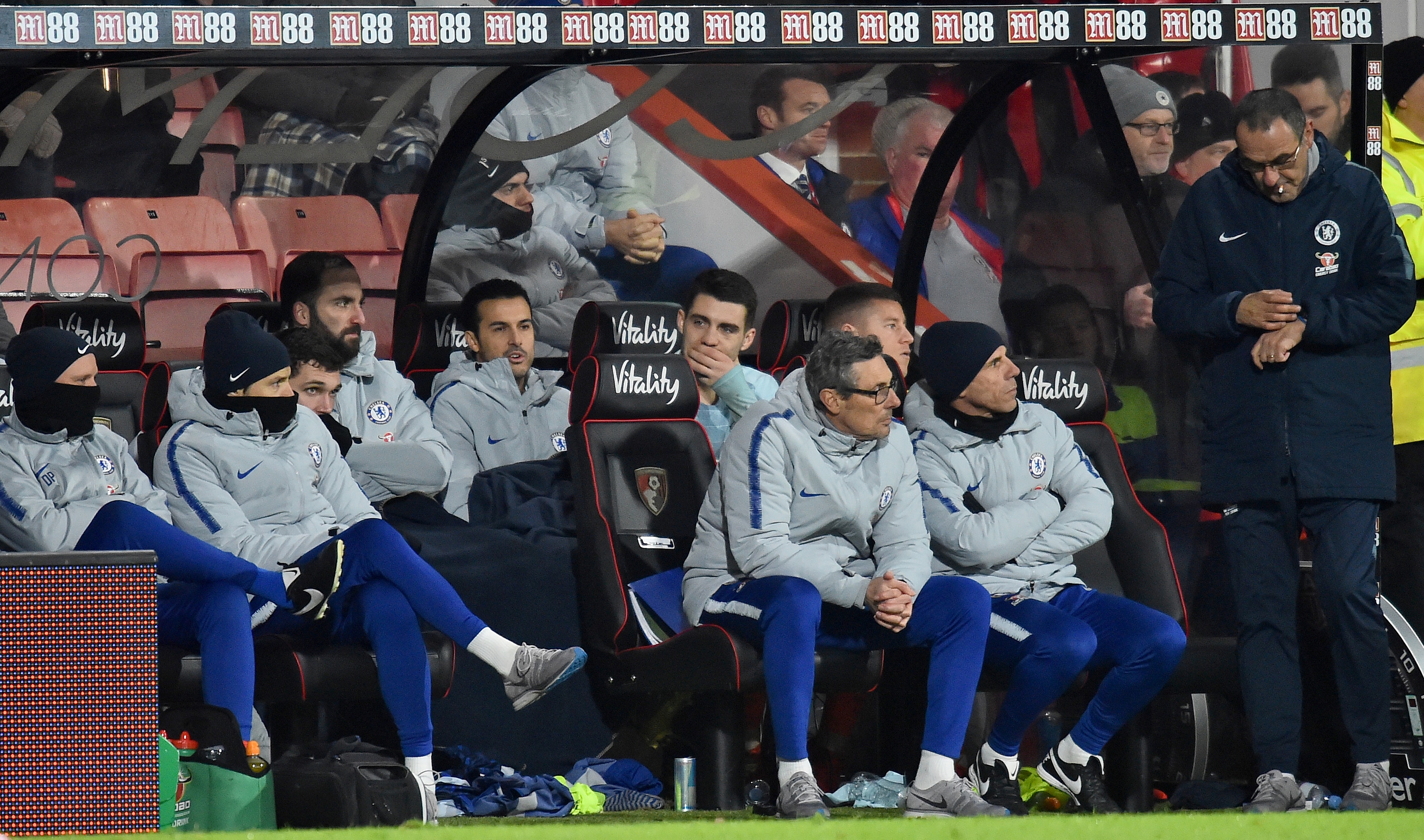 Chelsea's Italian head coach Maurizio Sarri (R) reacts during the English Premier League football match between Bournemouth and Chelsea at the Vitality Stadium in Bournemouth, southern England on January 30, 2019. (Photo by Glyn KIRK / AFP) / RESTRICTED TO EDITORIAL USE. No use with unauthorized audio, video, data, fixture lists, club/league logos or 'live' services. Online in-match use limited to 120 images. An additional 40 images may be used in extra time. No video emulation. Social media in-match use limited to 120 images. An additional 40 images may be used in extra time. No use in betting publications, games or single club/league/player publications. /         (Photo credit should read GLYN KIRK/AFP/Getty Images)