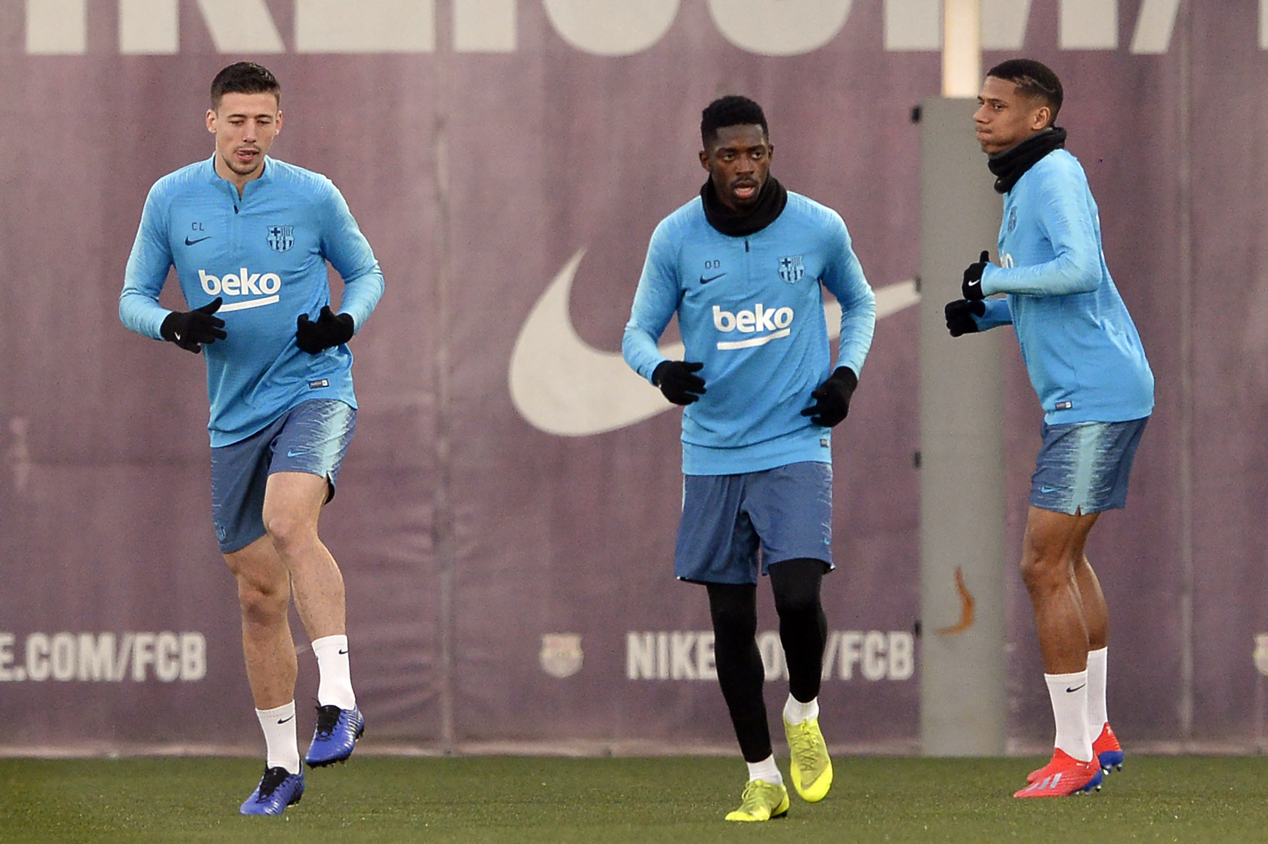 Barcelona's French defender Clement Lenglet (L), Barcelona's French forward Ousmane Dembele (C) and Barcelona's French defender Jean-Clair Todibo attend a training session at the Joan Gamper Sports Center in Sant Joan Despi on February 5, 2019. (Photo by Josep LAGO / AFP)        (Photo credit should read JOSEP LAGO/AFP/Getty Images)