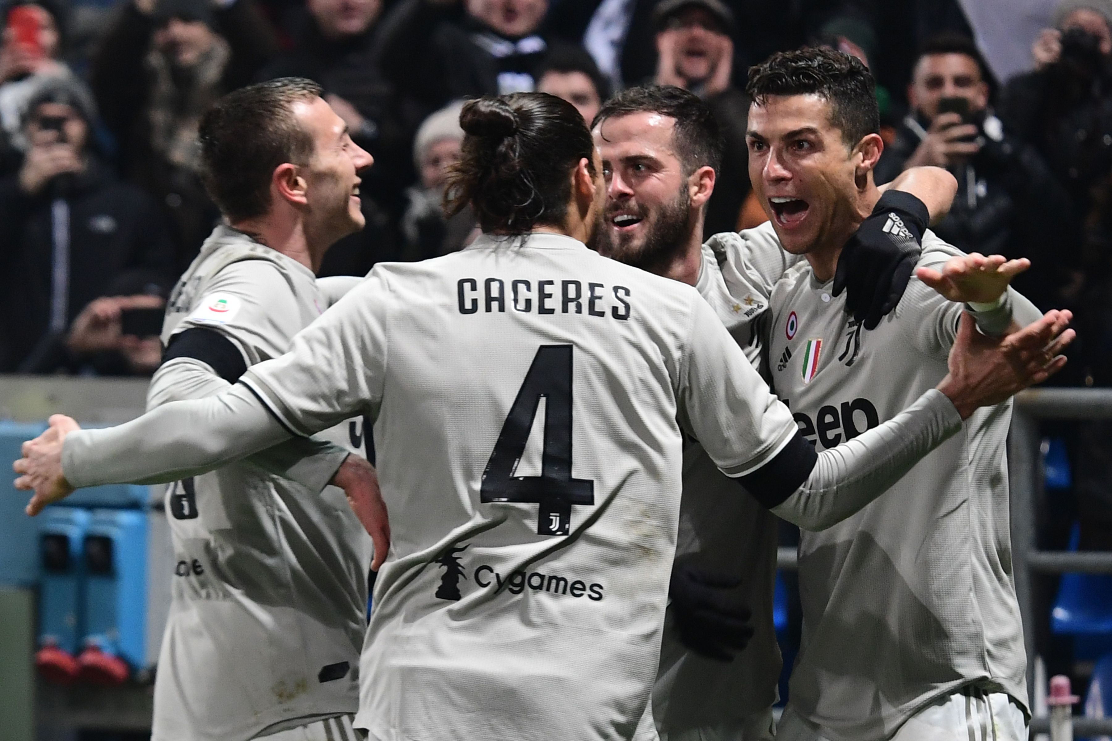 Juventus' Portuguese forward Cristiano Ronaldo (R) celebrates after scoring during the Italian Serie A football match Sassuolo vs Juventus on February 10, 2019 at the Mapei Stadium - Citta del Tricolore stadium in Reggio Emilia. (Photo by Miguel MEDINA / AFP)        (Photo credit should read MIGUEL MEDINA/AFP/Getty Images)