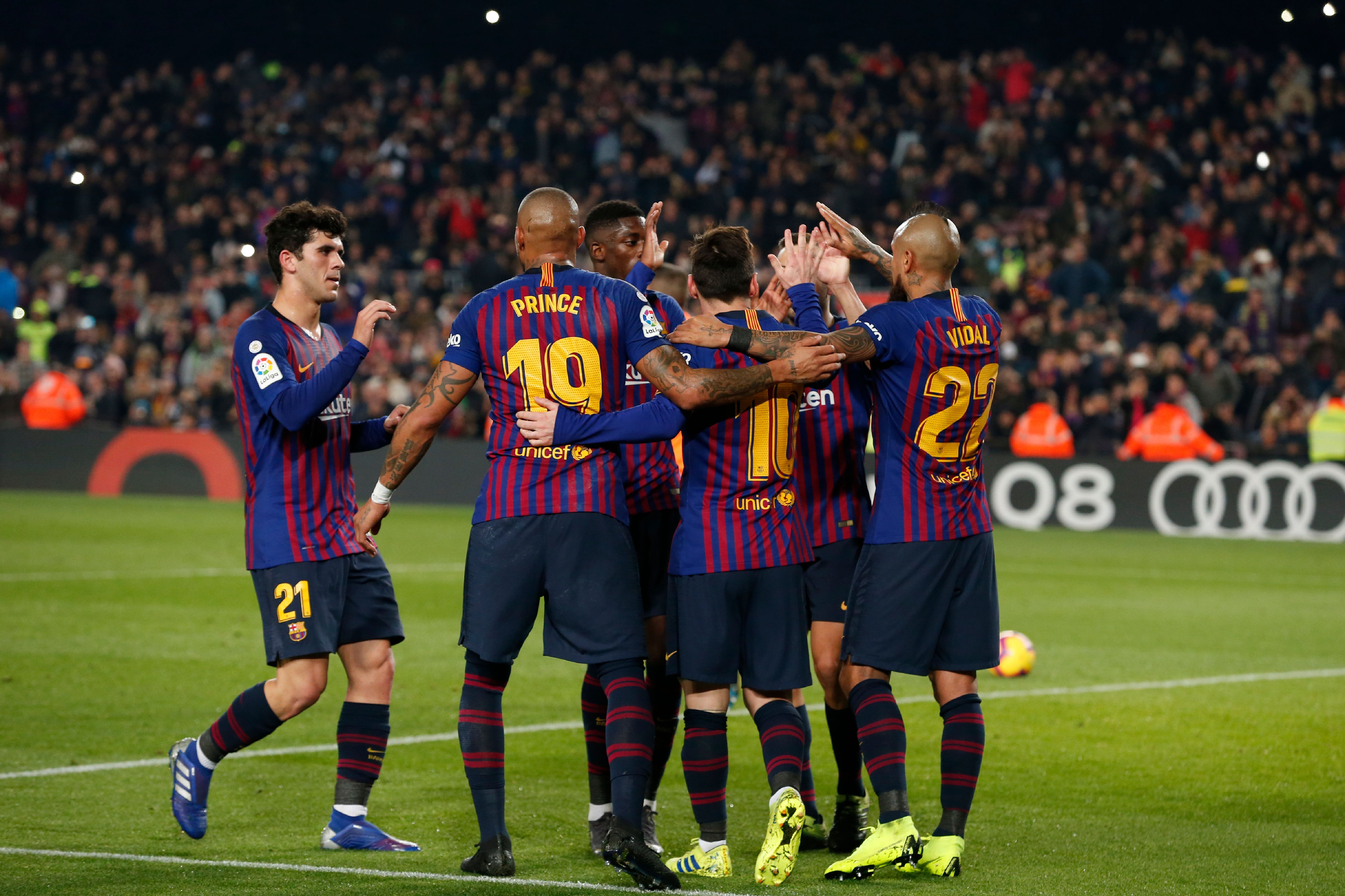 Barcelona's Argentinian forward Lionel Messi (2R) celebrates with teammates after scoring a goal during the Spanish League football match between Barcelona and Real Valladolid at the Camp Nou stadium in Barcelona on February 16, 2019. (Photo by Pau Barrena / AFP)        (Photo credit should read PAU BARRENA/AFP/Getty Images)