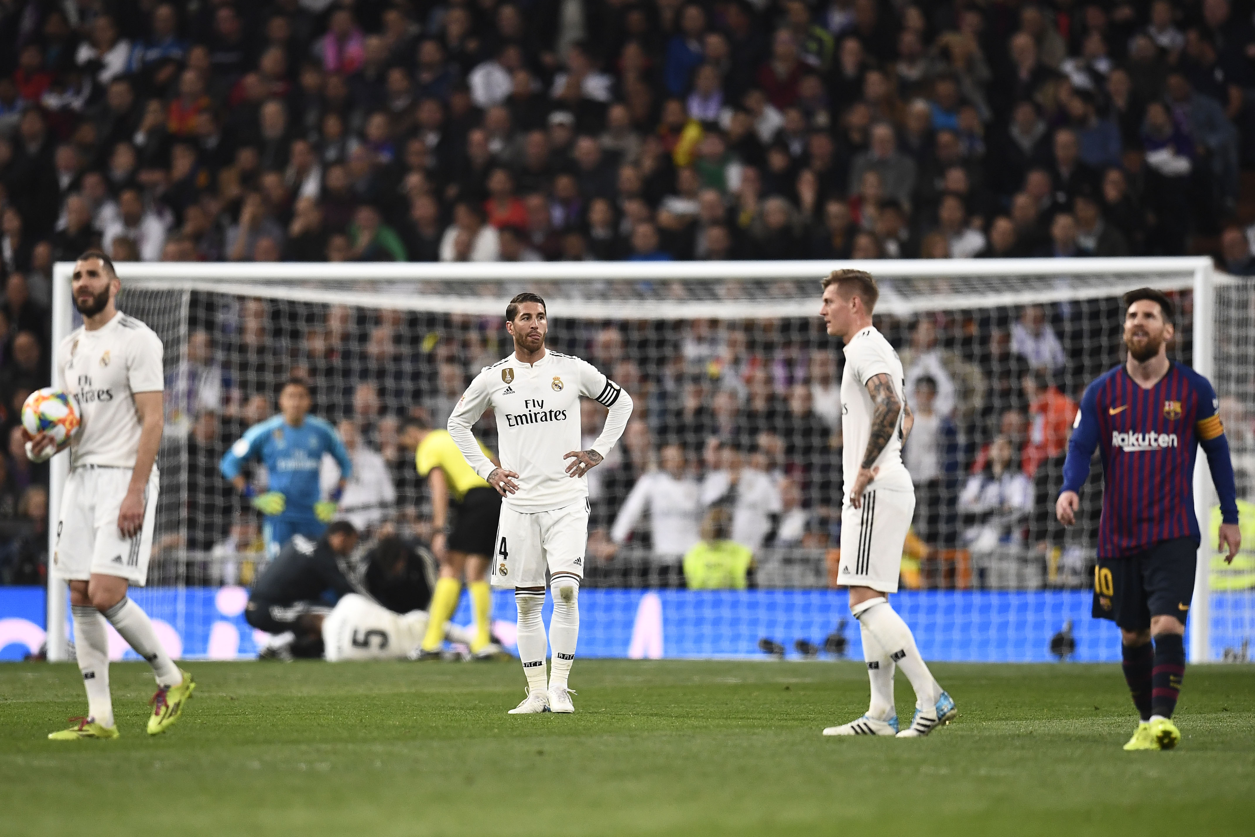 Real Madrid players react to Barcelona's second goal during the Spanish Copa del Rey (King's Cup) semi-final second leg football match between Real Madrid and Barcelona at the Santiago Bernabeu stadium in Madrid on February 27, 2019. (Photo by OSCAR DEL POZO / AFP)        (Photo credit should read OSCAR DEL POZO/AFP/Getty Images)