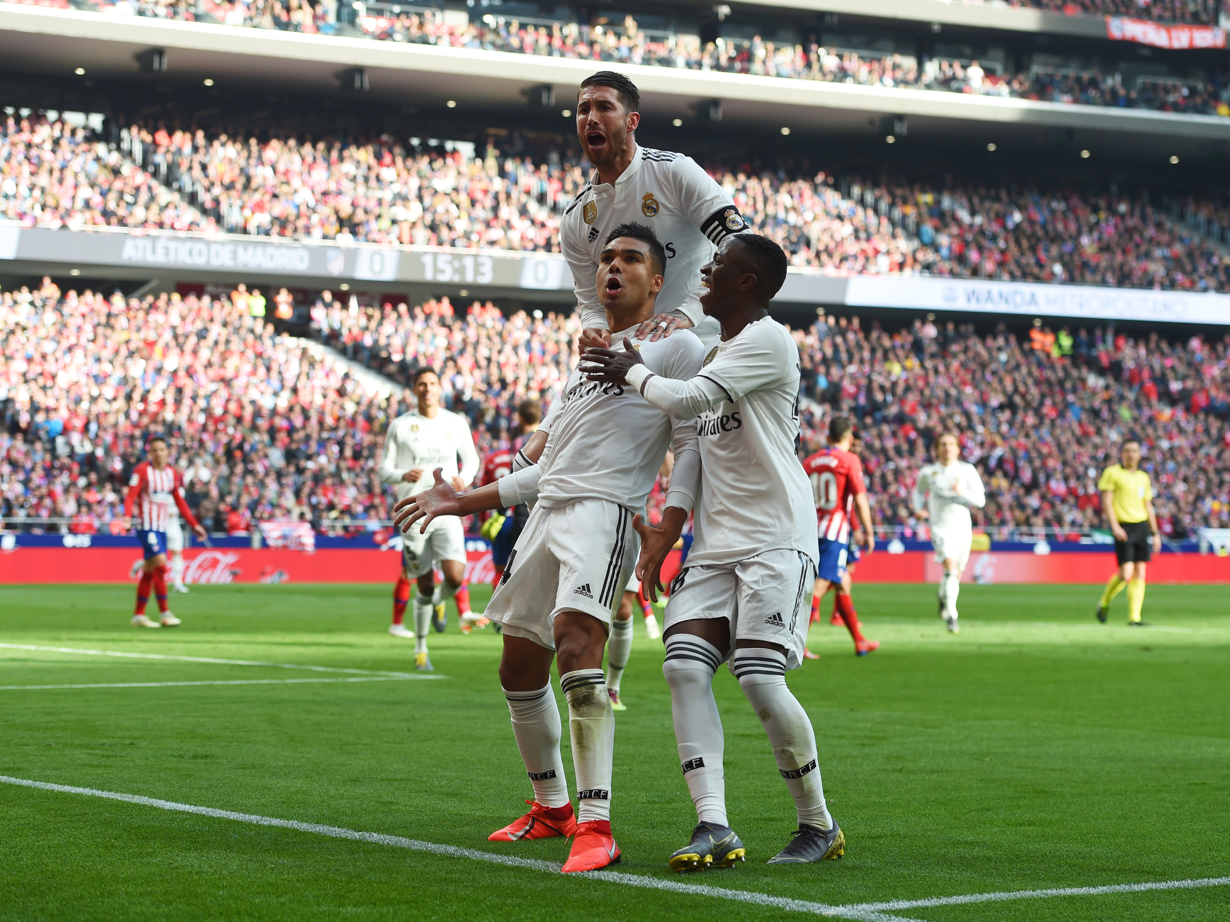 MADRID, SPAIN - FEBRUARY 09:   Casemiro of Real Madrid (14) celebrates after scoring his team's first goal with Sergio Ramos and Vinicius Junior during the La Liga match between Club Atletico de Madrid and Real Madrid CF at Wanda Metropolitano on February 09, 2019 in Madrid, Spain. (Photo by Denis Doyle/Getty Images)