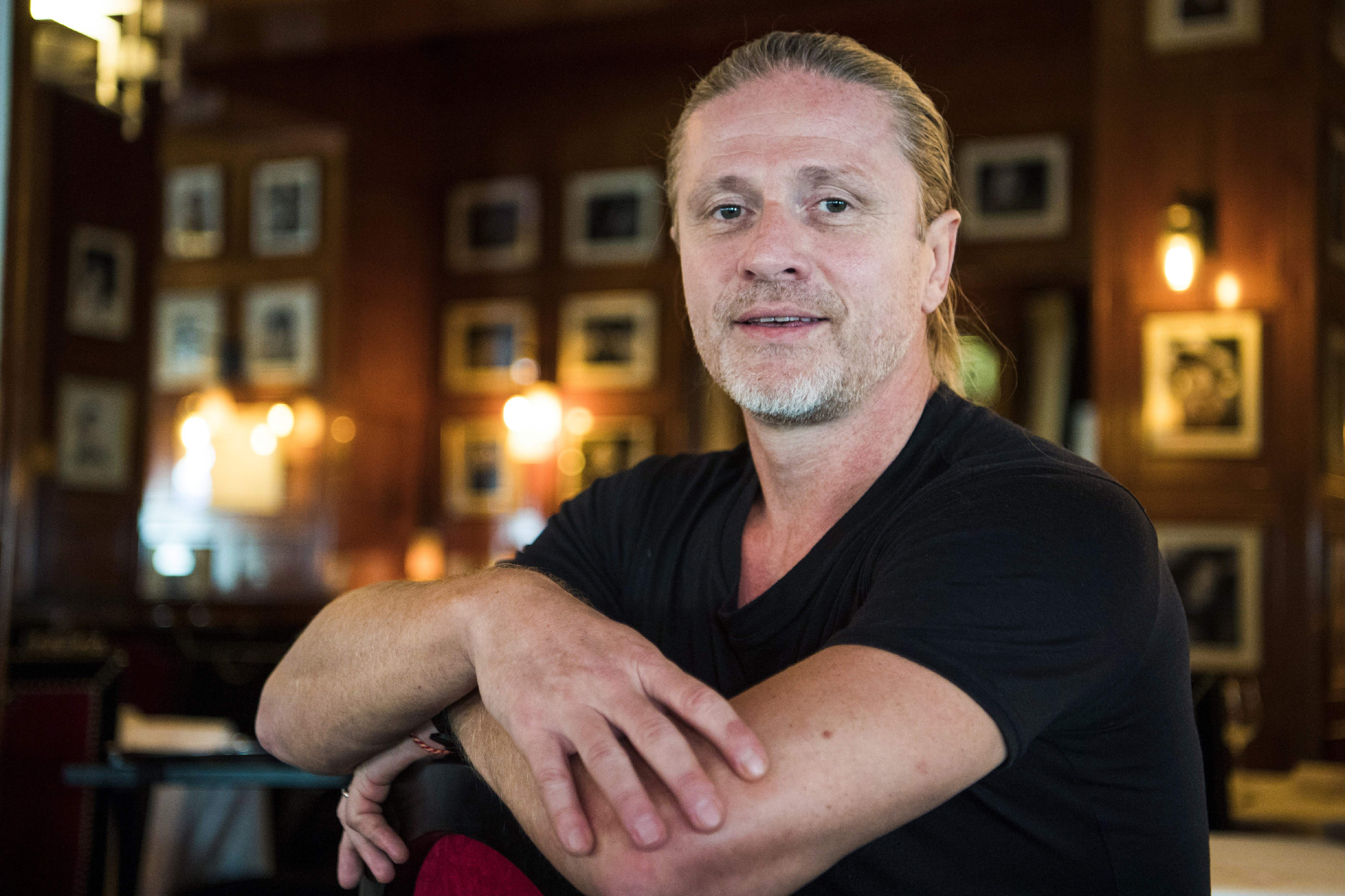 Former French midfielder and 1998 World Champion, Emmanuel Petit poses during a photo session on September 14, 2017 in Paris. 
Challenged Arsenal head coach Arsene Wenger "is still the man of the situation" said Arsenal former player Emmanuel Petit, who regrets "to see that this club no longer attracts top players." / AFP PHOTO / CHRISTOPHE SIMON        (Photo credit should read CHRISTOPHE SIMON/AFP/Getty Images)