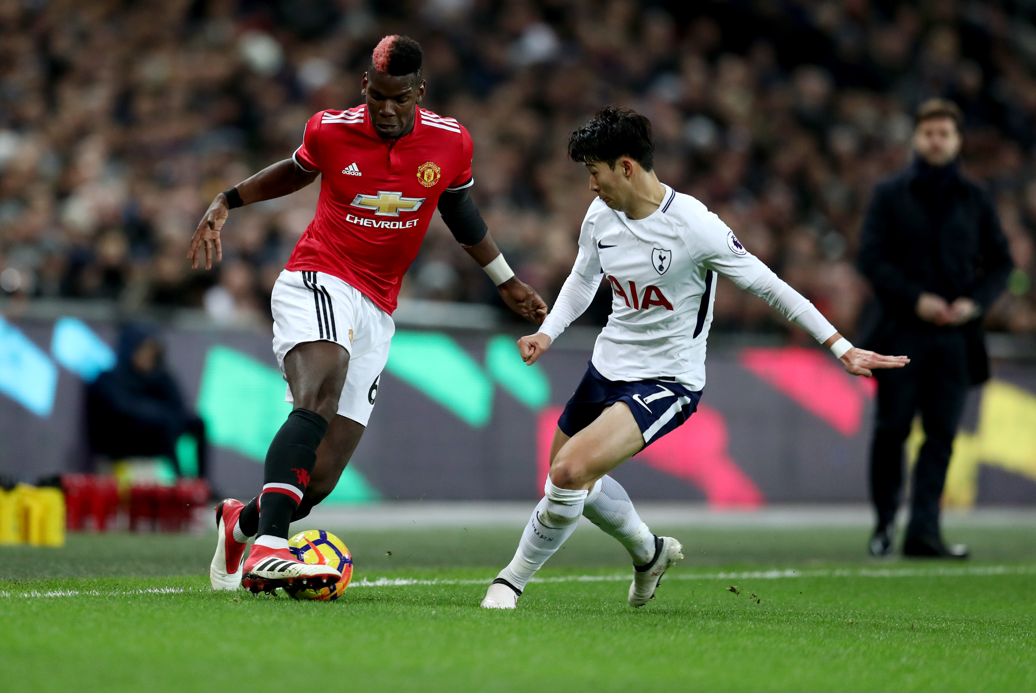 LONDON, ENGLAND - JANUARY 31: Paul Pogba of Manchester United and Son Heung-min of Tottenham Hotspur during the Premier League match between Tottenham Hotspur and Manchester United at Wembley Stadium on January 31, 2018 in London, England. (Photo by Catherine Ivill/Getty Images)