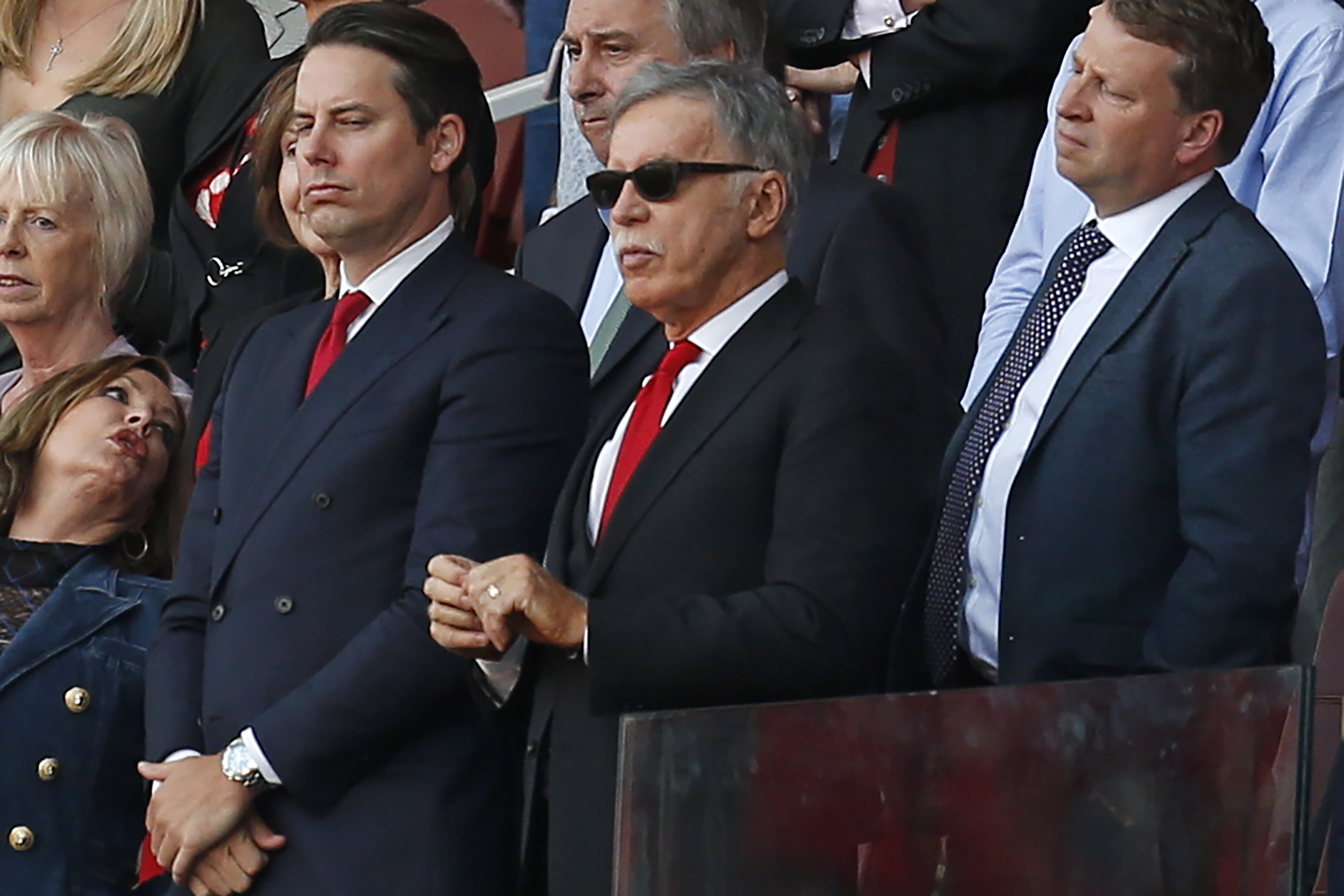 Arsenal's US owner Stan Kroenke (C) looks on during the presentation to Arsenal's French manager Arsene Wenger after the English Premier League football match between Arsenal and Burnley at the Emirates Stadium in London on May 6, 2018. (Photo by Ian KINGTON / IKIMAGES / AFP) / RESTRICTED TO EDITORIAL USE. No use with unauthorized audio, video, data, fixture lists, club/league logos or 'live' services. Online in-match use limited to 45 images, no video emulation. No use in betting, games or single club/league/player publications. /         (Photo credit should read IAN KINGTON/AFP/Getty Images)
