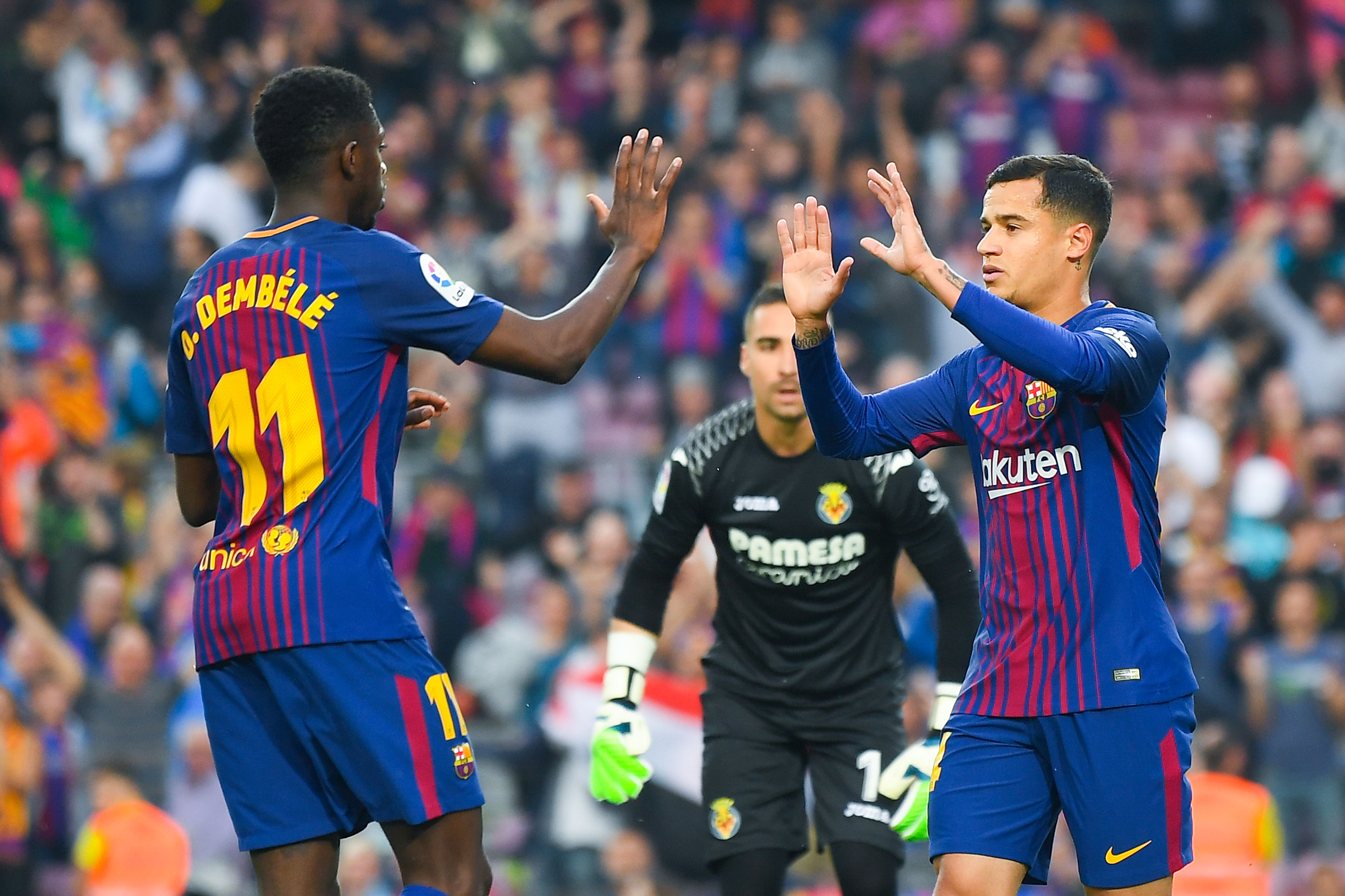 BARCELONA, SPAIN - MAY 09:  Philippe Coutinho (R) of FC Barcelona celebrates with his team mate Oussame Dembele after scoring his team's first goal the La Liga match between Barcelona and Real Madrid at Camp Nou on May 9, 2018 in Barcelona, Spain.  (Photo by David Ramos/Getty Images)