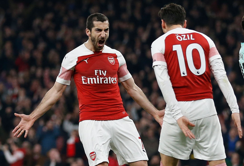 LONDON, ENGLAND - FEBRUARY 27: Henrikh Mkhitaryan of Arsenal celebrates scoring his sides second goal with Mesut Ozil of Arsenal during the Premier League match between Arsenal FC and AFC Bournemouth at Emirates Stadium on February 27, 2019 in London, United Kingdom. (Photo by Catherine Ivill/Getty Images)