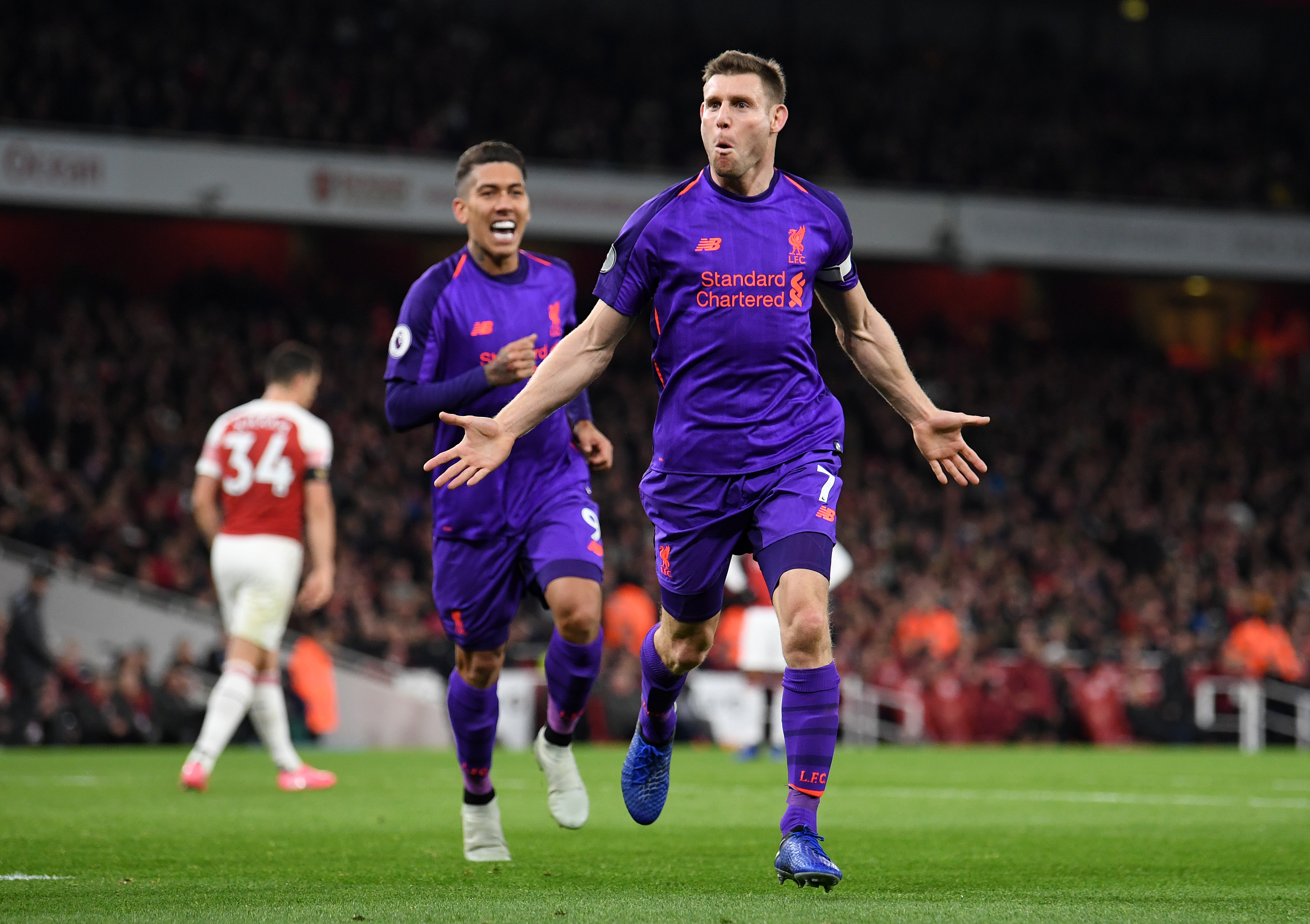 LONDON, ENGLAND - NOVEMBER 03:  James Milner of Liverpool celebrates after he scores his sides first goal during the Premier League match between Arsenal FC and Liverpool FC at Emirates Stadium on November 3, 2018 in London, United Kingdom.  (Photo by Michael Regan/Getty Images)