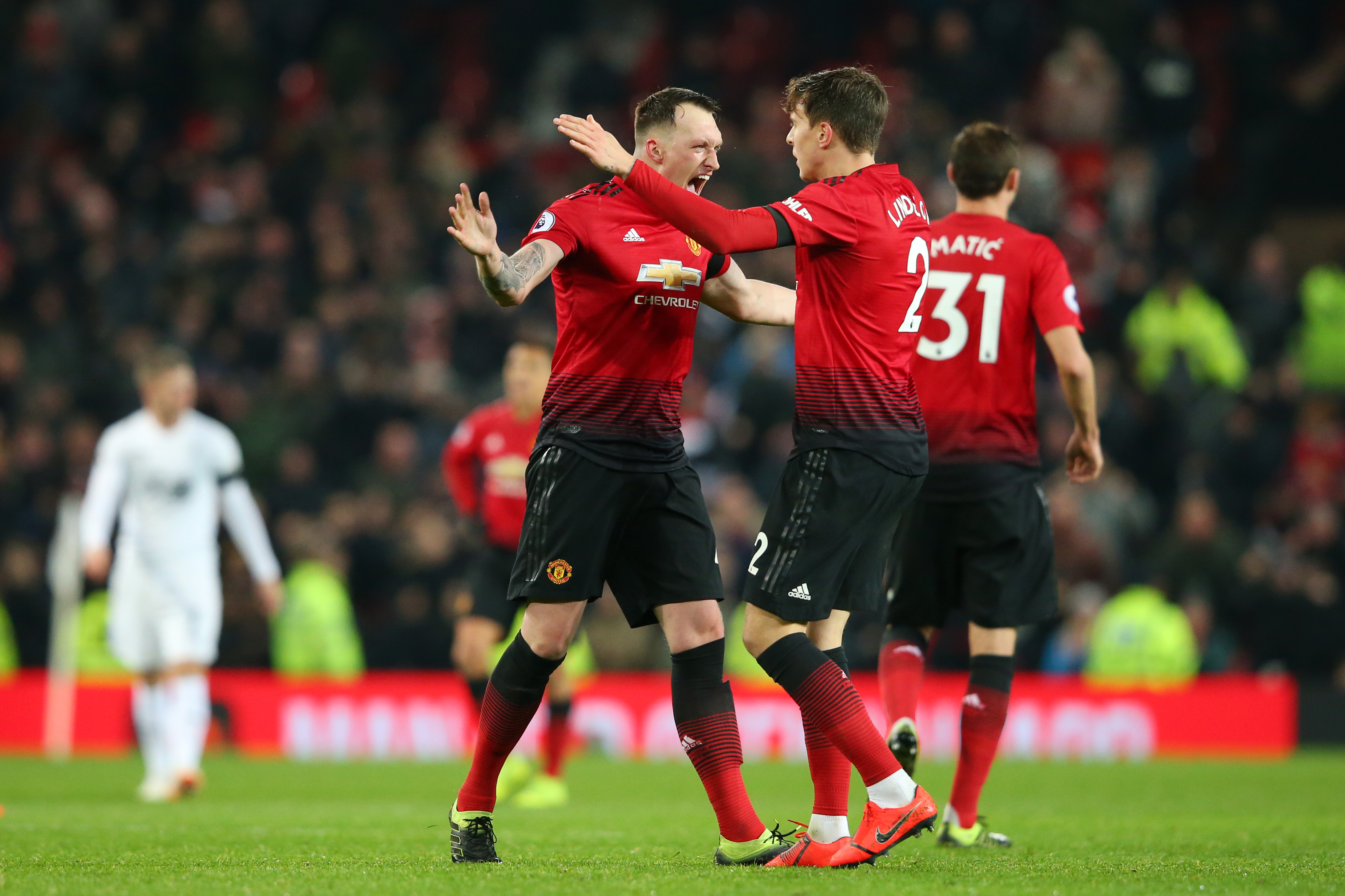 MANCHESTER, ENGLAND - JANUARY 29: Victor Lindelof of Manchester United celebrates after scoring his team's second goal with Phil Jones of Manchester United during the Premier League match between Manchester United and Burnley at Old Trafford on January 29, 2019 in Manchester, United Kingdom.  (Photo by Alex Livesey/Getty Images)