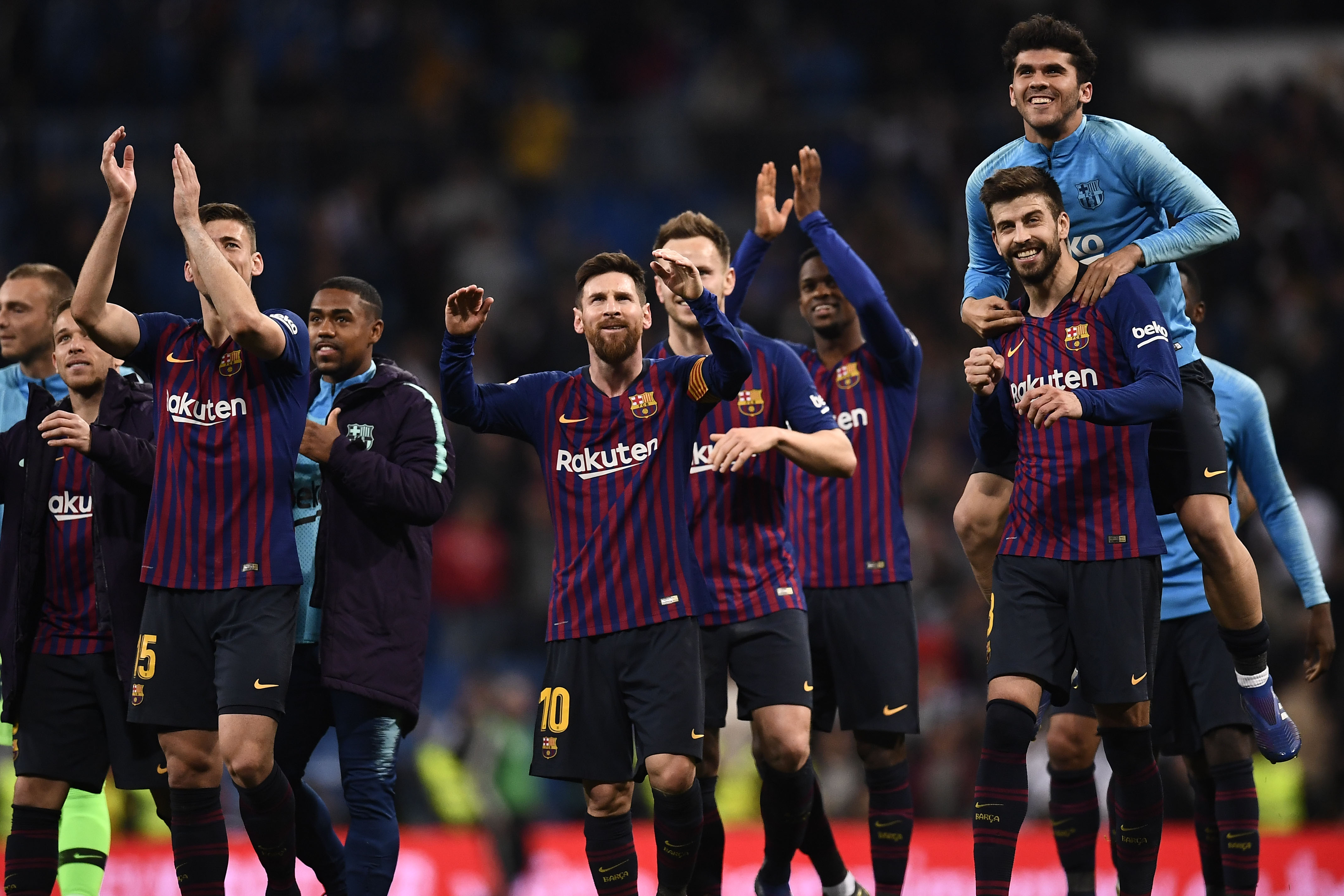 Barcelona players celebrate their win at the end of the Spanish league football match between Real Madrid CF and FC Barcelona at the Santiago Bernabeu stadium in Madrid on March 2, 2019. (Photo by OSCAR DEL POZO / AFP)        (Photo credit should read OSCAR DEL POZO/AFP/Getty Images)