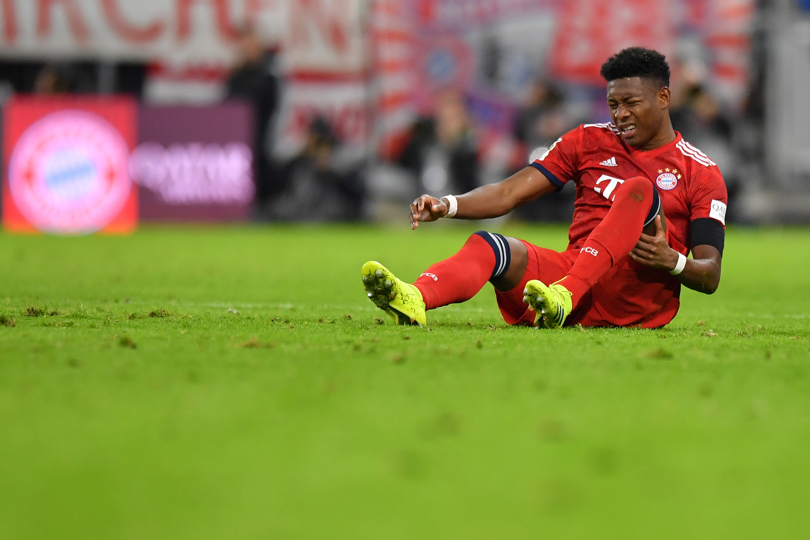 MUNICH, GERMANY - FEBRUARY 09: David Alaba of Bayern Munich holds his thigh during the Bundesliga match between FC Bayern Muenchen and FC Schalke 04 at Allianz Arena on February 09, 2019 in Munich, Germany. (Photo by Sebastian Widmann/Bongarts/Getty Images)