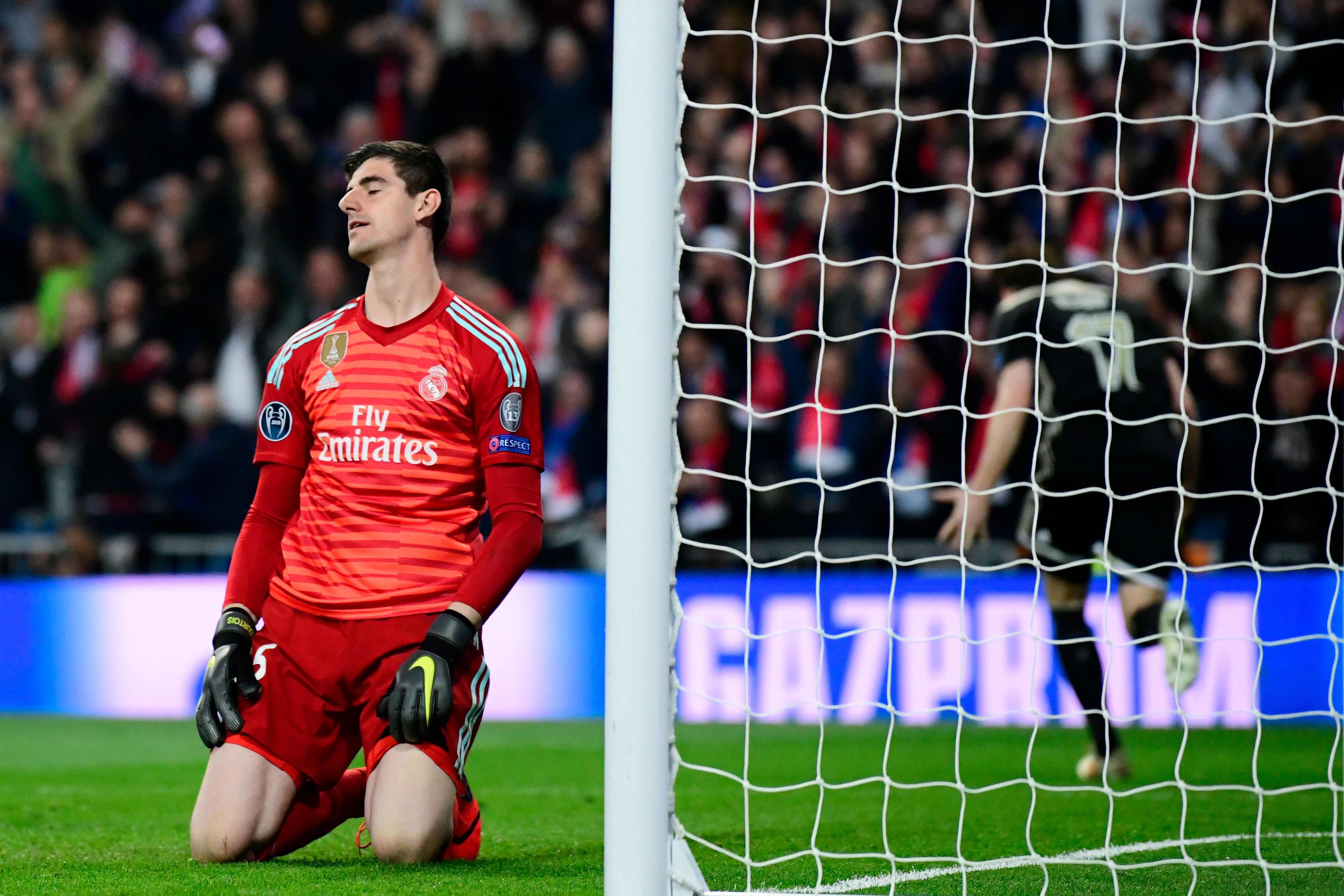 Real Madrid's Belgian goalkeeper Thibaut Courtois reacts as he concedes a fourth goal during the UEFA Champions League round of 16 second leg football match between Real Madrid CF and Ajax at the Santiago Bernabeu stadium in Madrid on March 5, 2019. (Photo by GABRIEL BOUYS / AFP)        (Photo credit should read GABRIEL BOUYS/AFP/Getty Images)