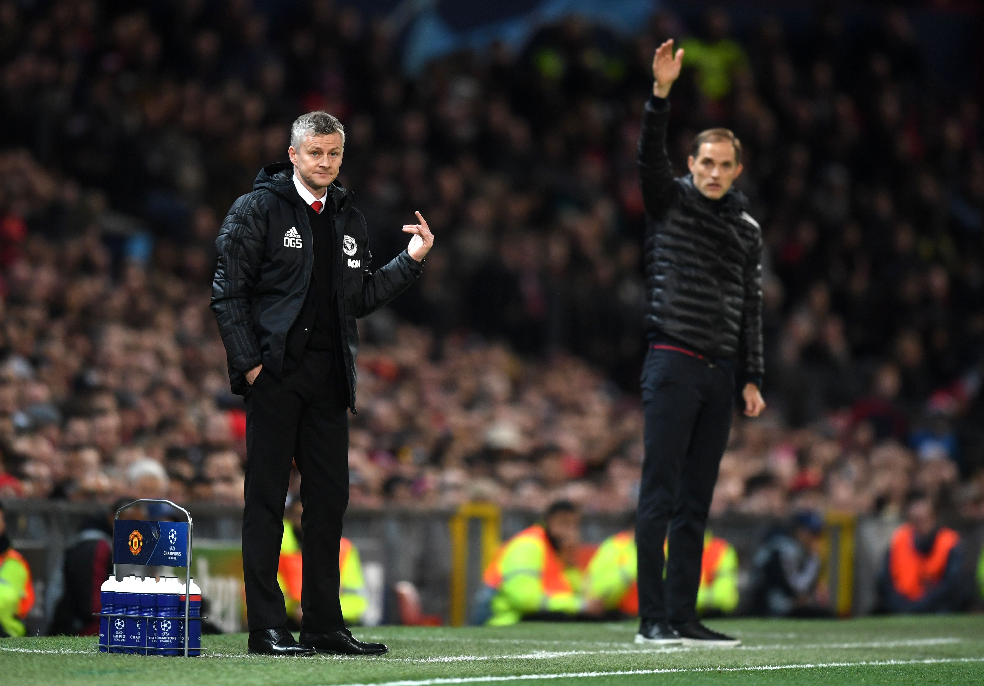 MANCHESTER, ENGLAND - FEBRUARY 12: Ole Gunnar Solskjaer, Manager of Manchester United and Thomas Tuchel, Manager of PSG stand on the touchline during the UEFA Champions League Round of 16 First Leg match between Manchester United and Paris Saint-Germain at Old Trafford on February 12, 2019 in Manchester, England. (Photo by Michael Regan/Getty Images)