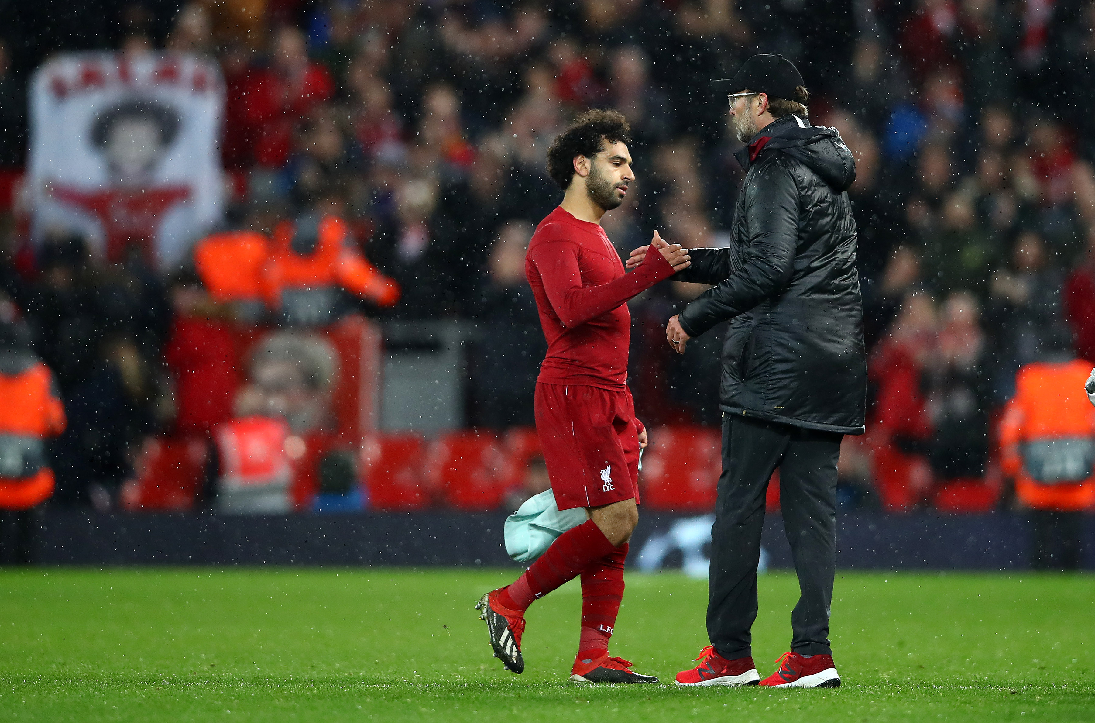 LIVERPOOL, ENGLAND - FEBRUARY 19: Mohamed Salah of Liverpool with his manager Jurgen Klopp at the final whistle during the UEFA Champions League Round of 16 First Leg match between Liverpool and FC Bayern Muenchen at Anfield on February 19, 2019 in Liverpool, England. (Photo by Clive Brunskill/Getty Images)