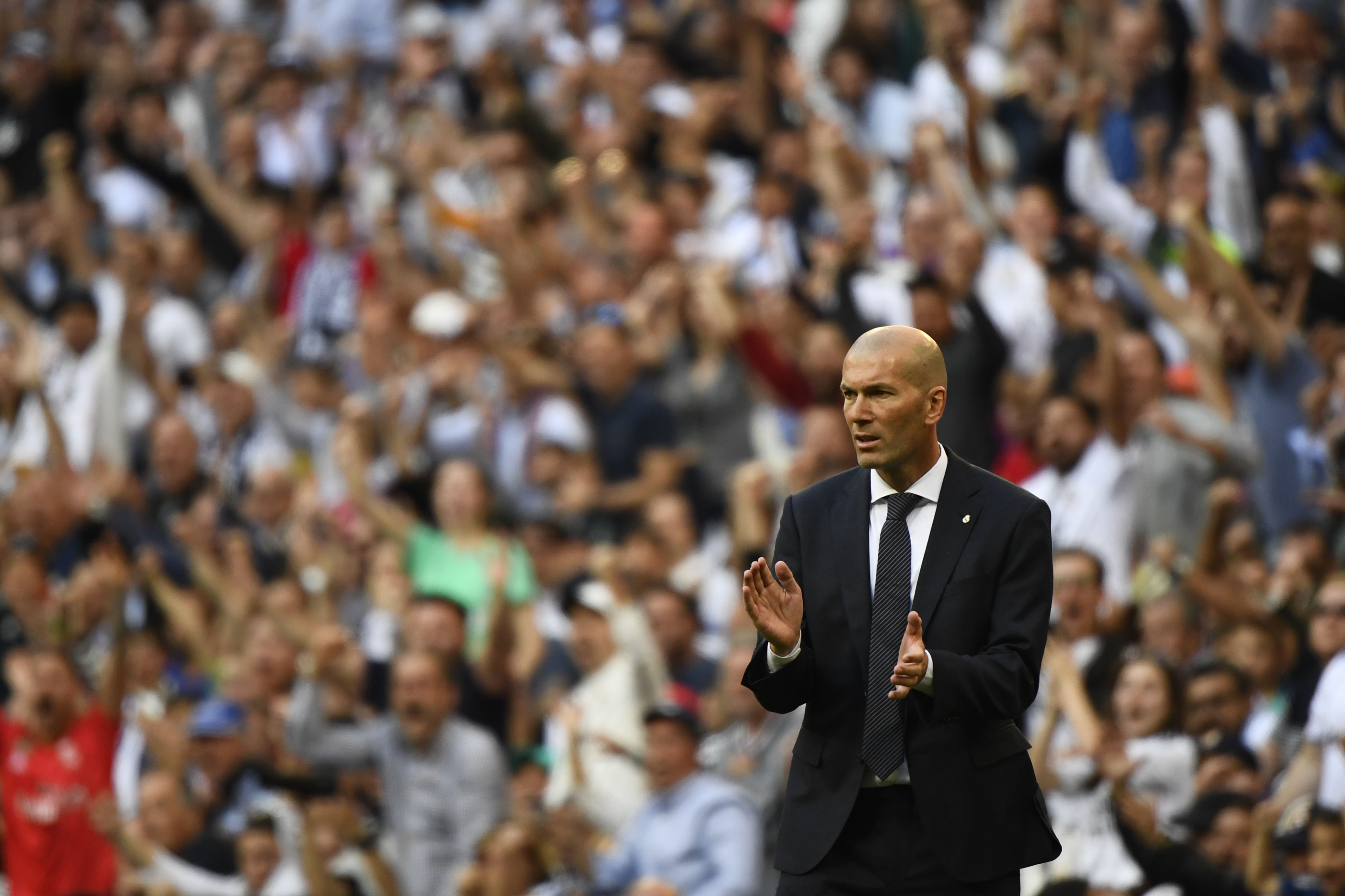 Real Madrid's French coach Zinedine Zidane celebrates their opening goal during the Spanish league football match between Real Madrid CF and RC Celta de Vigo at the Santiago Bernabeu stadium in Madrid on March 16, 2019. (Photo by GABRIEL BOUYS / AFP)        (Photo credit should read GABRIEL BOUYS/AFP/Getty Images)