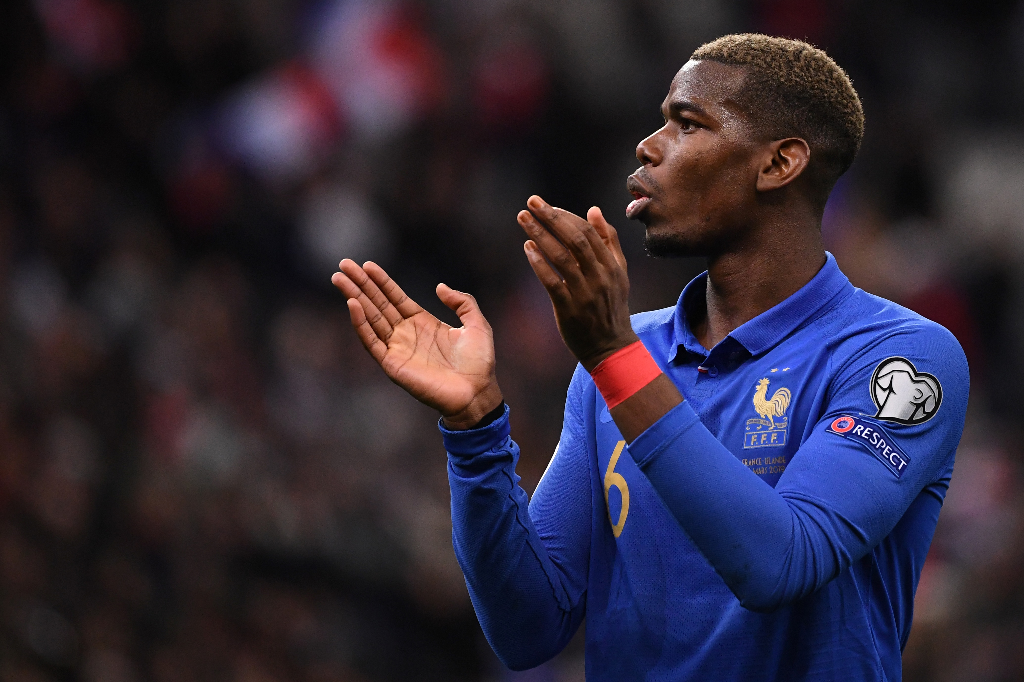 France's midfielder Paul Pogba celebrates after France's win of the UEFA Euro 2020 Group H qualification football match between France and Iceland at the Stade de France stadium in Saint-Denis, north of Paris, on March 25, 2019. - The match ended 4-0 for France. (Photo by FRANCK FIFE / AFP)        (Photo credit should read FRANCK FIFE/AFP/Getty Images)