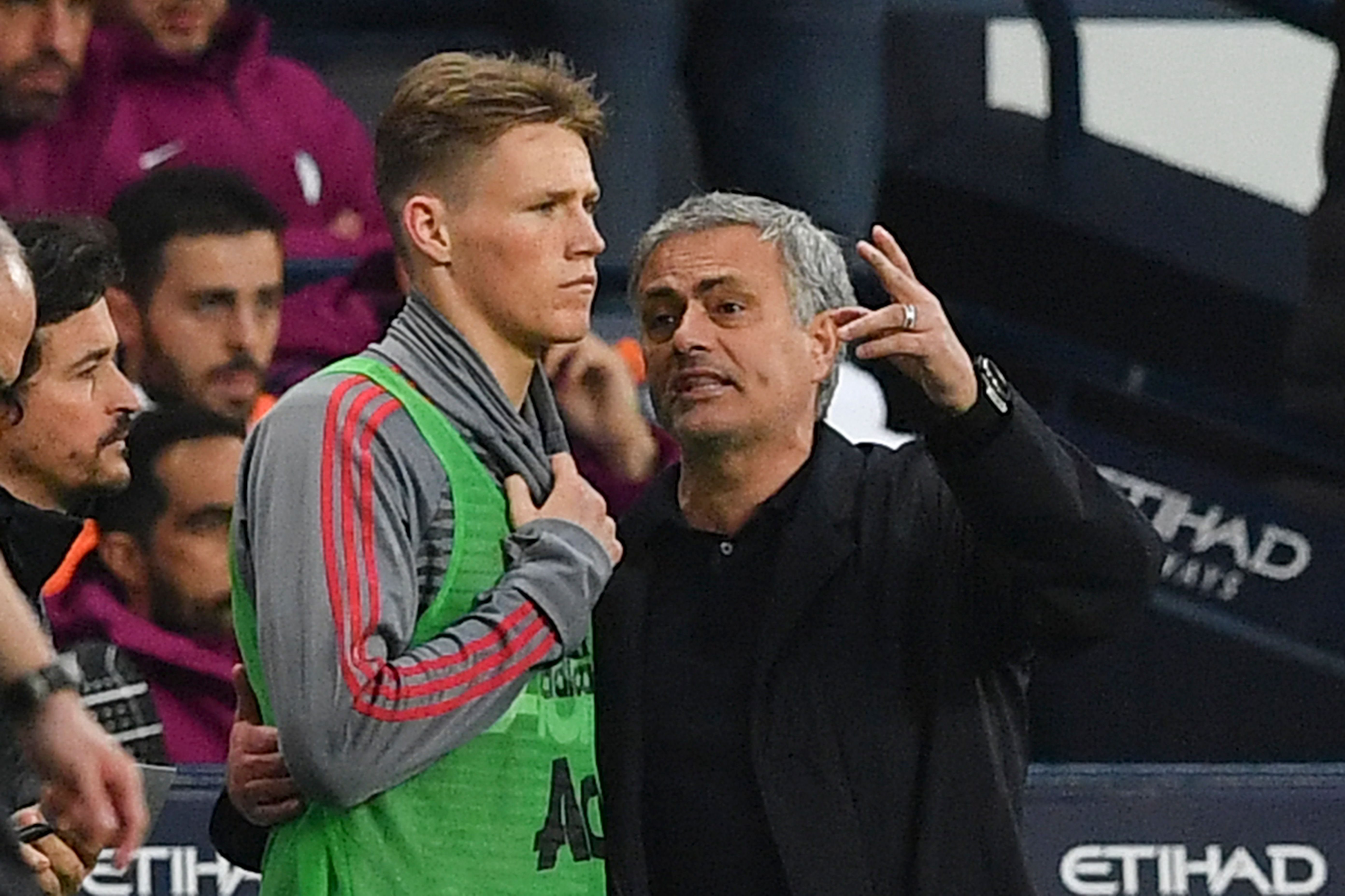 Manchester United's Portuguese manager Jose Mourinho (R) talks with Manchester United's midfielder Scott McTominay (L) on the touchline during the English Premier League football match between Manchester City and Manchester United at the Etihad Stadium in Manchester, north west England, on April 7, 2018. / AFP PHOTO / Ben STANSALL / RESTRICTED TO EDITORIAL USE. No use with unauthorized audio, video, data, fixture lists, club/league logos or 'live' services. Online in-match use limited to 75 images, no video emulation. No use in betting, games or single club/league/player publications.  /         (Photo credit should read BEN STANSALL/AFP/Getty Images)
