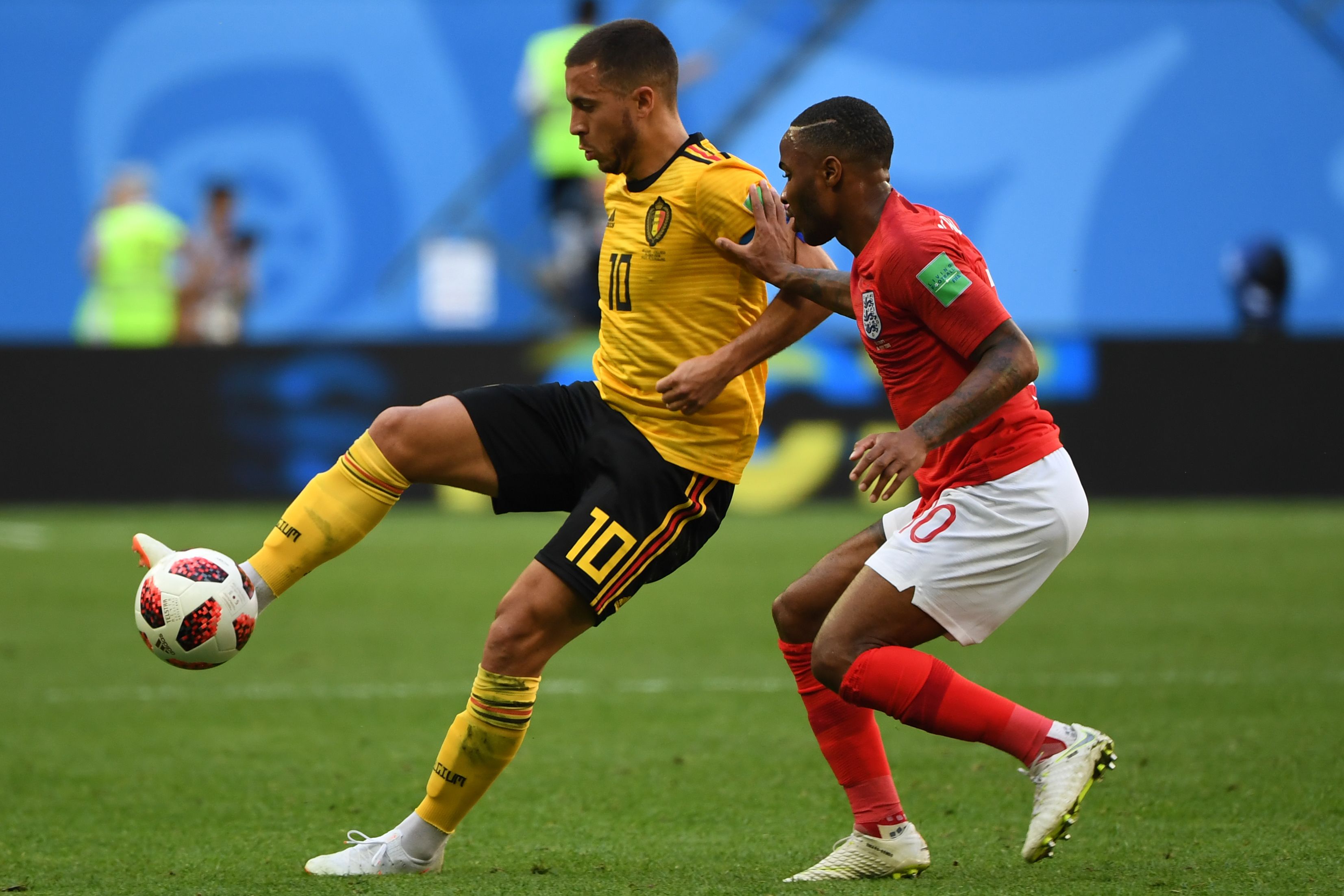 Belgium's forward Eden Hazard (L) fights for the ball with England's forward Raheem Sterling during their Russia 2018 World Cup play-off for third place football match between Belgium and England at the Saint Petersburg Stadium in Saint Petersburg on July 14, 2018. (Photo by Paul ELLIS / AFP) / RESTRICTED TO EDITORIAL USE - NO MOBILE PUSH ALERTS/DOWNLOADS        (Photo credit should read PAUL ELLIS/AFP/Getty Images)