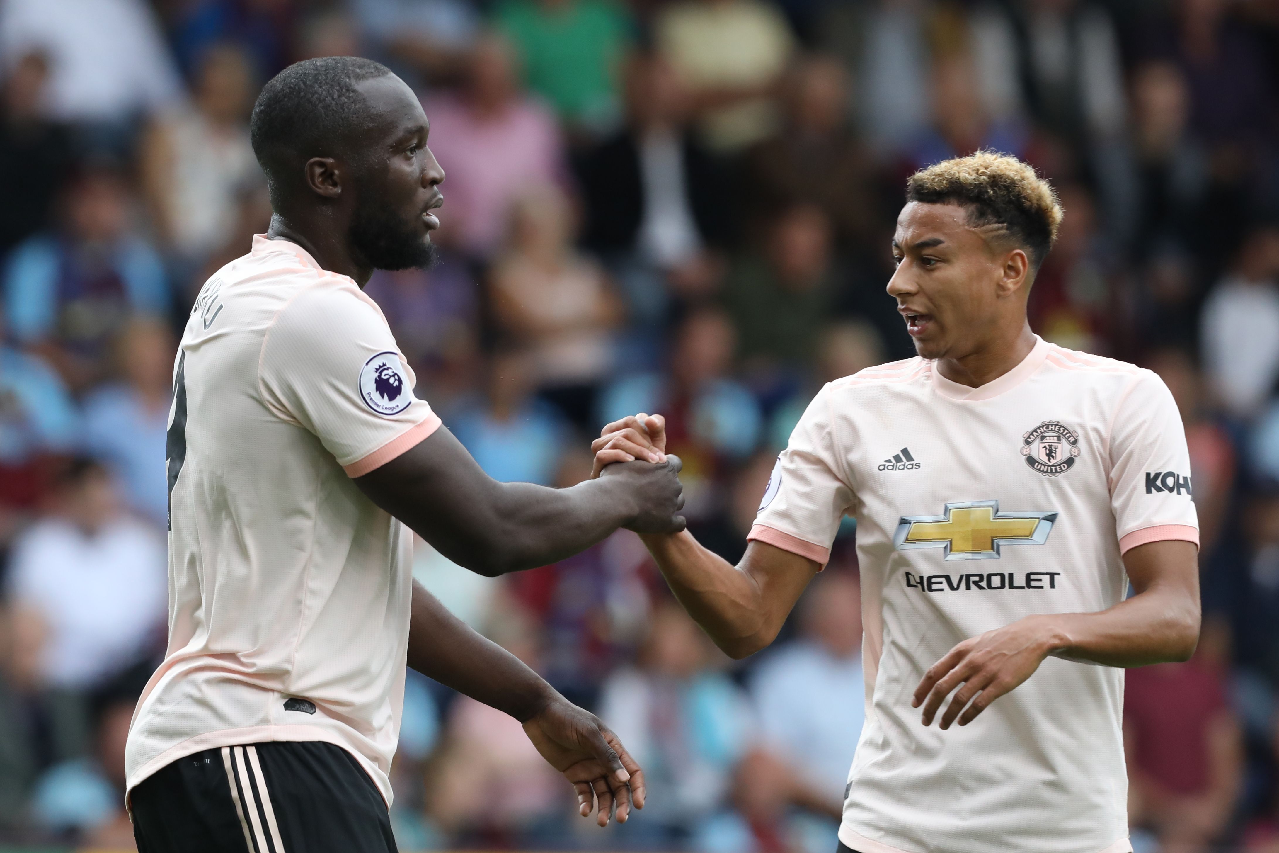 Manchester United's Belgian striker Romelu Lukaku (L) celebrates scoring the team's first goal with Manchester United's English midfielder Jesse Lingard  during the English Premier League football match between Burnley and Manchester United at Turf Moor in Burnley, north west England on September 2, 2018. (Photo by Lindsey PARNABY / AFP) / RESTRICTED TO EDITORIAL USE. No use with unauthorized audio, video, data, fixture lists, club/league logos or 'live' services. Online in-match use limited to 120 images. An additional 40 images may be used in extra time. No video emulation. Social media in-match use limited to 120 images. An additional 40 images may be used in extra time. No use in betting publications, games or single club/league/player publications. /         (Photo credit should read LINDSEY PARNABY/AFP/Getty Images)