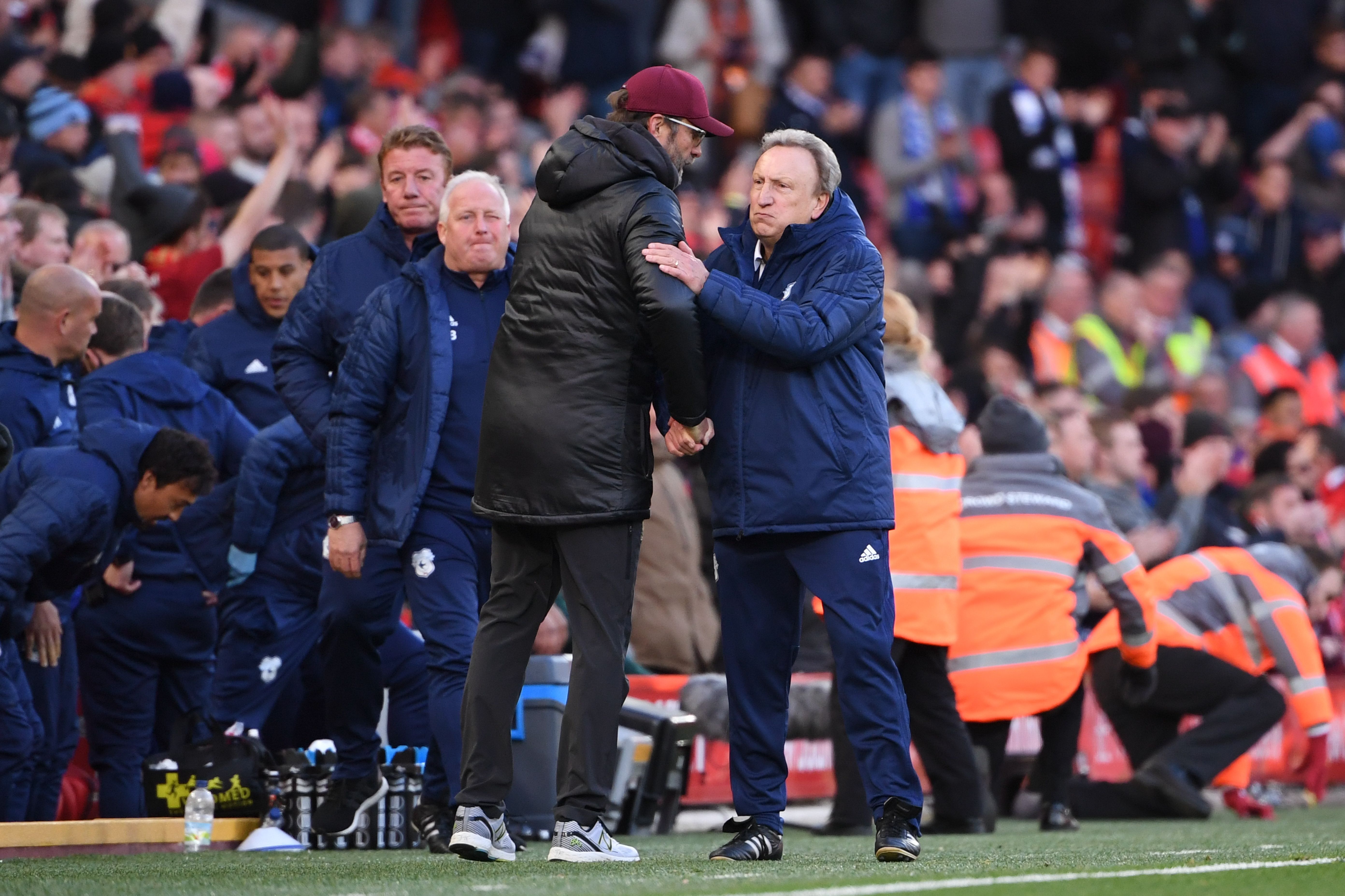 Liverpool's German manager Jurgen Klopp (L) shakes hands with Cardiff City's English manager Neil Warnock (R) at the end of the English Premier League football match between Liverpool and Cardiff City at Anfield in Liverpool, north west England on October 27, 2018. (Photo by Paul ELLIS / AFP) / RESTRICTED TO EDITORIAL USE. No use with unauthorized audio, video, data, fixture lists, club/league logos or 'live' services. Online in-match use limited to 120 images. An additional 40 images may be used in extra time. No video emulation. Social media in-match use limited to 120 images. An additional 40 images may be used in extra time. No use in betting publications, games or single club/league/player publications. /         (Photo credit should read PAUL ELLIS/AFP/Getty Images)