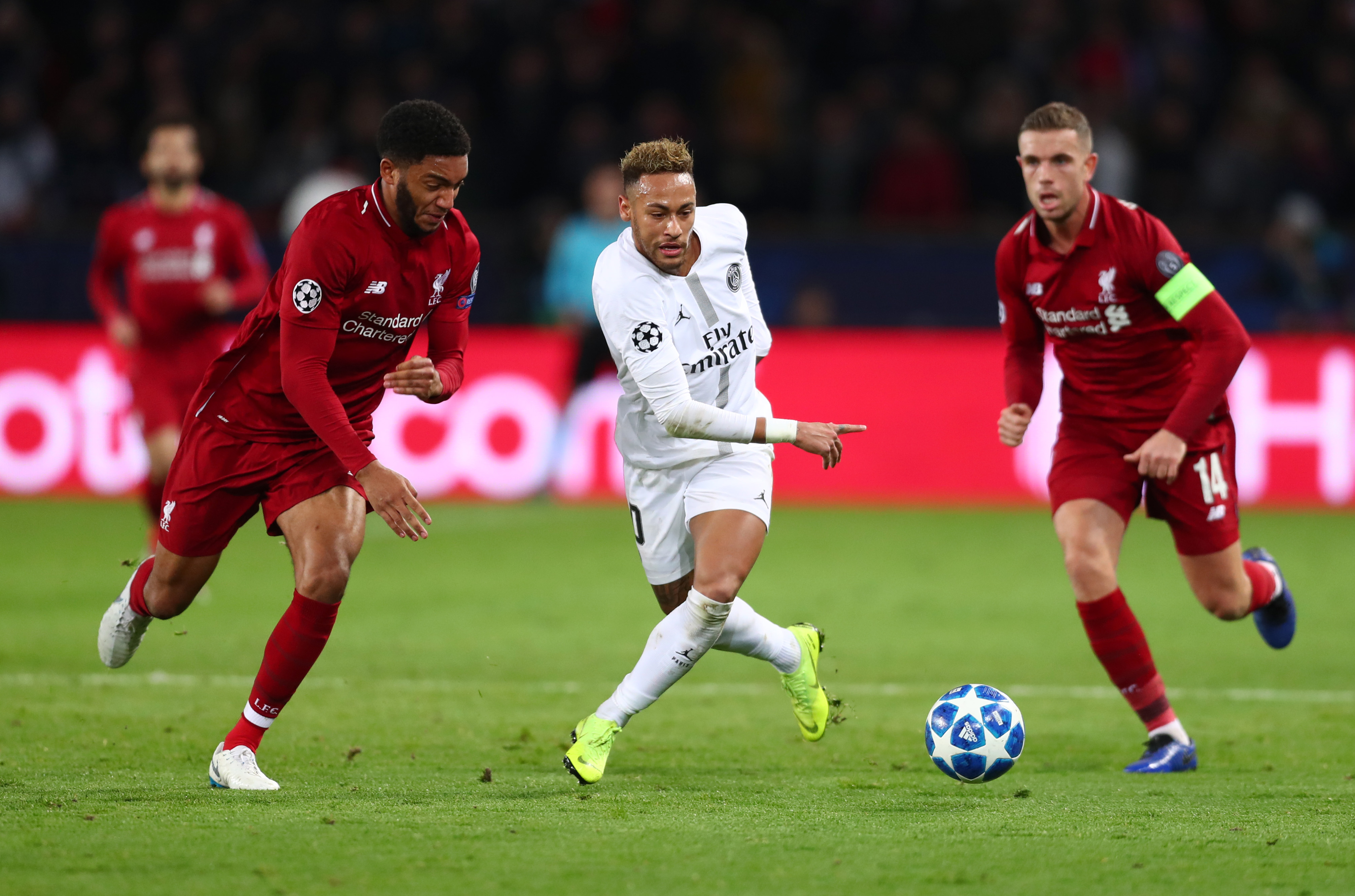 PARIS, FRANCE - NOVEMBER 28:  Neymar of Paris Saint-Germain is challenged by Joe Gomez and Jordan Henderson of Liverpool during the UEFA Champions League Group C match between Paris Saint-Germain and Liverpool at Parc des Princes on November 28, 2018 in Paris, France.  (Photo by Clive Rose/Getty Images)