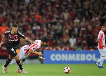 Bruno Guimaraes (L) of Brazils Atletico Paranaense vies for the ball with Jeferson Gomez of Colombia's Junior during the 2018 Copa Sudamericana second leg final football match at the Arena da Baixada stadium in Curitiba, Brazil, on December 12, 2018. (Photo by Heuler Andrey / AFP)        (Photo credit should read HEULER ANDREY/AFP/Getty Images)