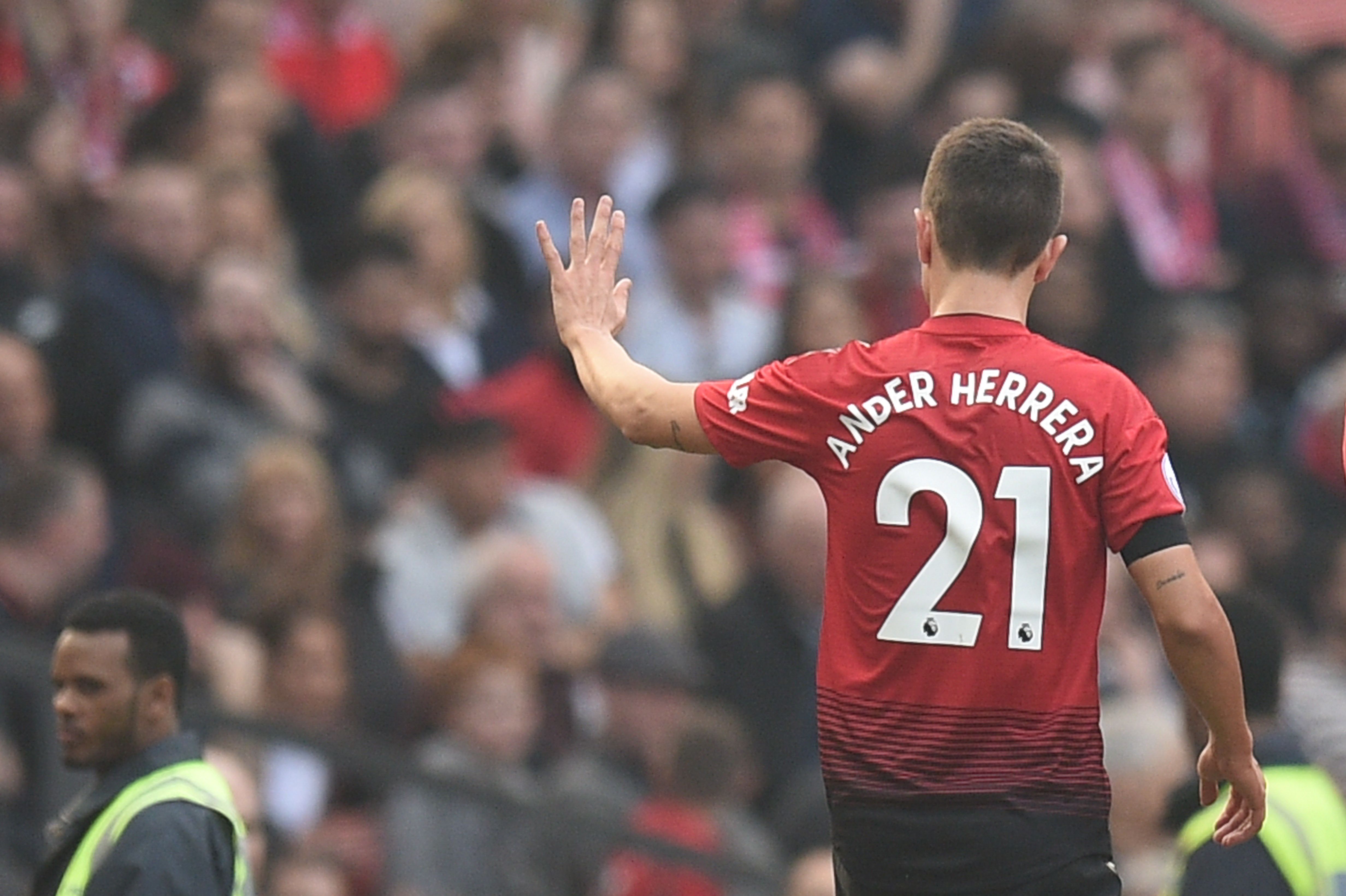 Manchester United's Spanish midfielder Ander Herrera waves as he leaves the pitch injured during the English Premier League football match between Manchester United and Liverpool at Old Trafford in Manchester, north west England, on February 24, 2019. (Photo by Oli SCARFF / AFP) / RESTRICTED TO EDITORIAL USE. No use with unauthorized audio, video, data, fixture lists, club/league logos or 'live' services. Online in-match use limited to 120 images. An additional 40 images may be used in extra time. No video emulation. Social media in-match use limited to 120 images. An additional 40 images may be used in extra time. No use in betting publications, games or single club/league/player publications. /         (Photo credit should read OLI SCARFF/AFP/Getty Images)