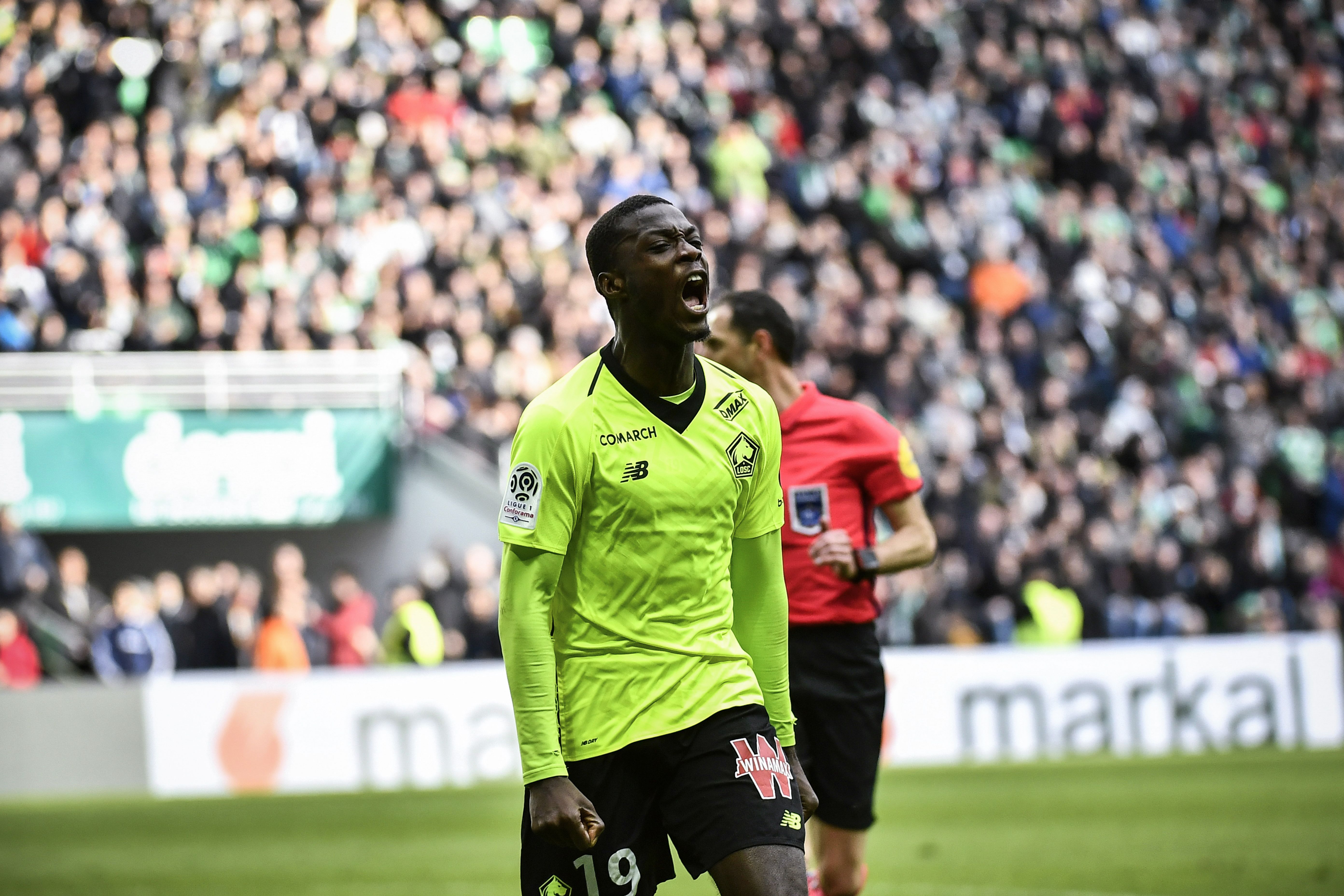 Lille's Ivorian forward Nicolas Pepe celebrates after scoring a goal during the L1 football match AS Saint-Etienne (ASSE) vs Lille (LOSC) on March 10, 2019, at the Geoffroy Guichard Stadium in Saint-Etienne, central France. (Photo by JEFF PACHOUD / AFP)        (Photo credit should read JEFF PACHOUD/AFP/Getty Images)