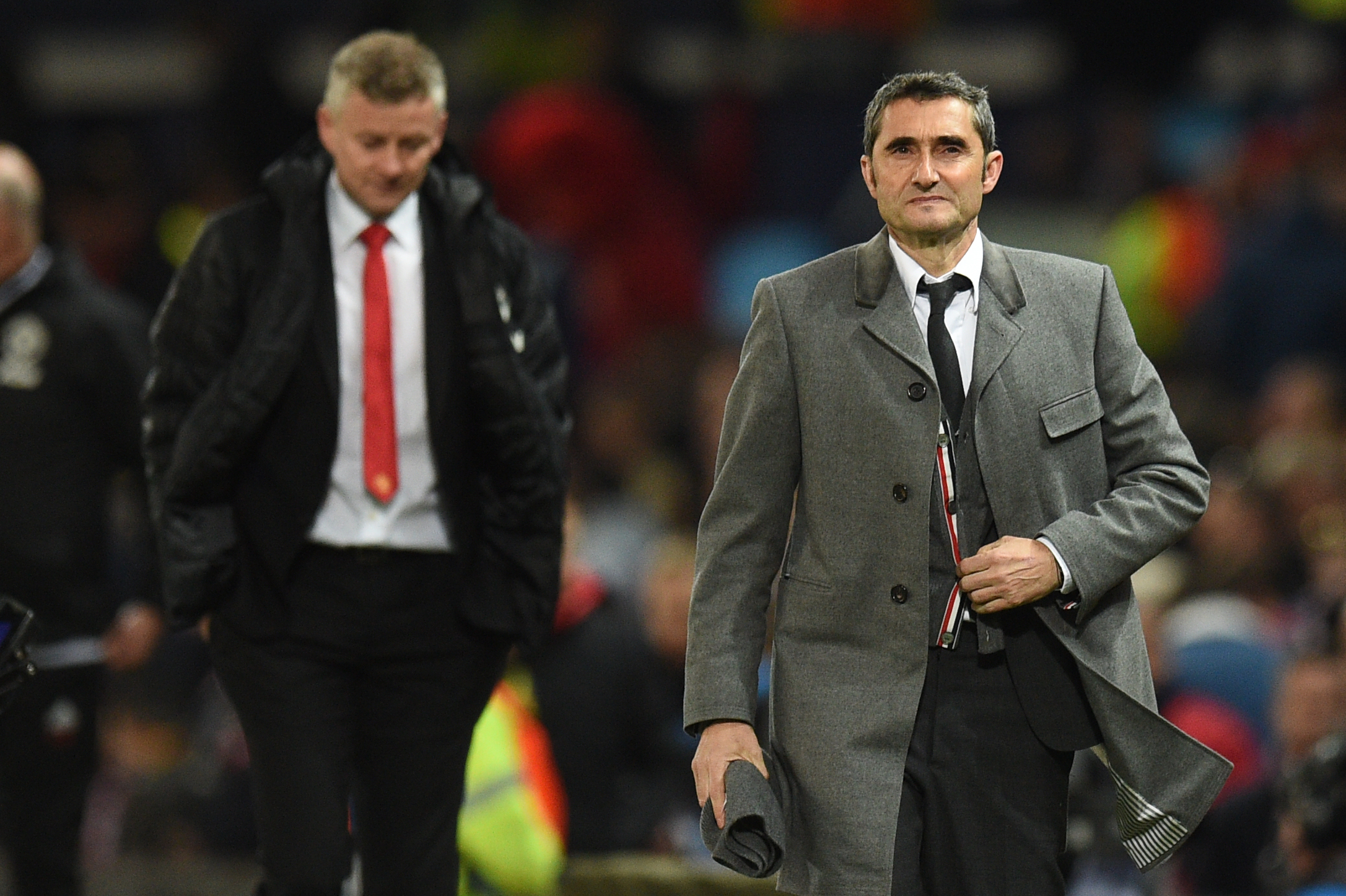 Manchester United's Norwegian manager Ole Gunnar Solskjaer (L) and Barcelona's Spanish coach Ernesto Valverde walk off at half time during the UEFA Champions league first leg quarter-final football match between Manchester United and Barcelona at Old Trafford in Manchester, north west England, on April 10, 2019. (Photo by Oli SCARFF / AFP)        (Photo credit should read OLI SCARFF/AFP/Getty Images)