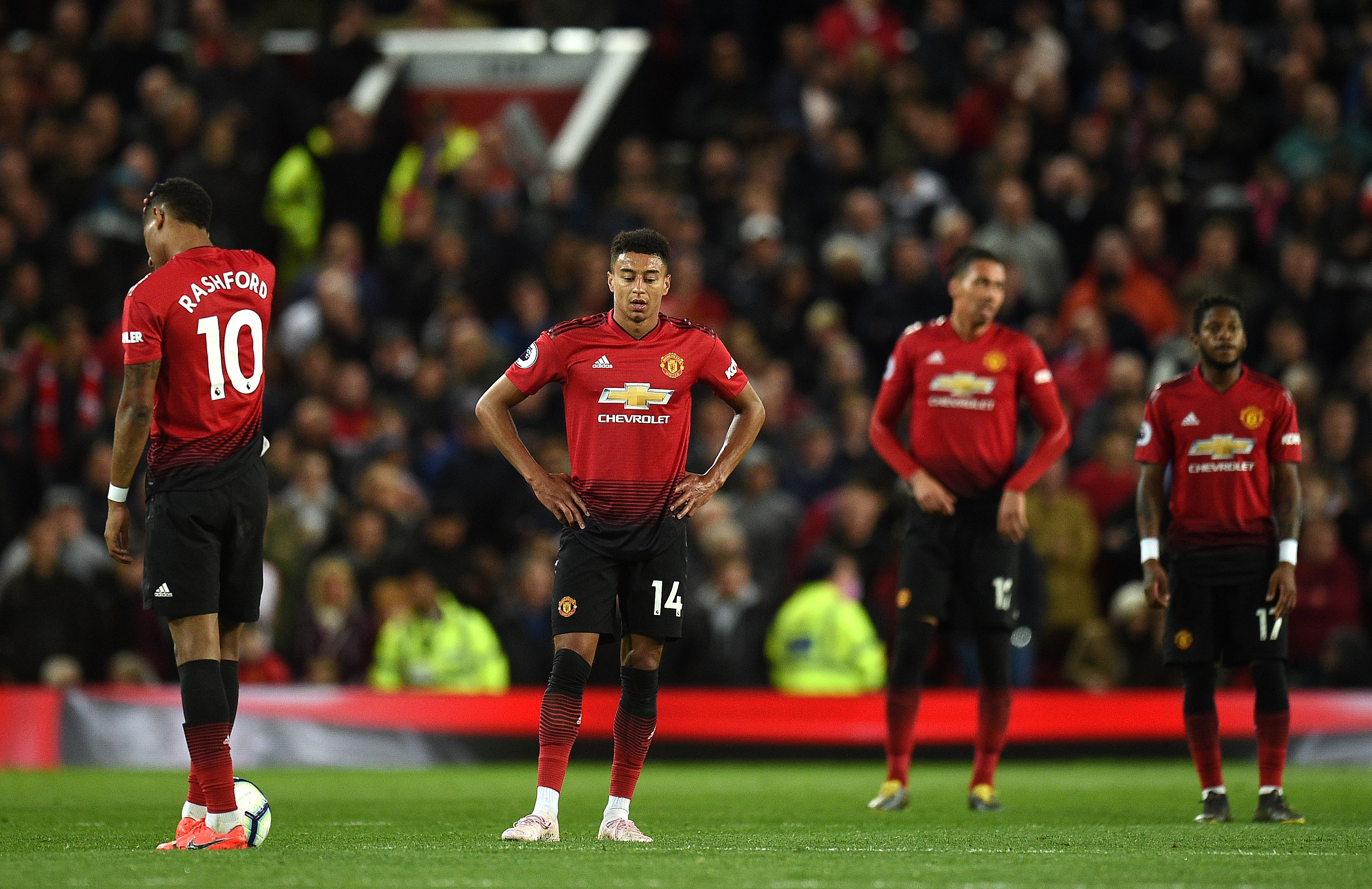 Manchester United's English forward Marcus Rashford (L), Manchester United's English midfielder Jesse Lingard (2L), Manchester United's English defender Chris Smalling (2R) and Manchester United's Brazilian midfielder Fred react after conceding a goal during the English Premier League football match between Manchester United and Manchester City at Old Trafford in Manchester, north west England, on April 24, 2019. (Photo by Oli SCARFF / AFP) / RESTRICTED TO EDITORIAL USE. No use with unauthorized audio, video, data, fixture lists, club/league logos or 'live' services. Online in-match use limited to 120 images. An additional 40 images may be used in extra time. No video emulation. Social media in-match use limited to 120 images. An additional 40 images may be used in extra time. No use in betting publications, games or single club/league/player publications. /         (Photo credit should read OLI SCARFF/AFP/Getty Images)