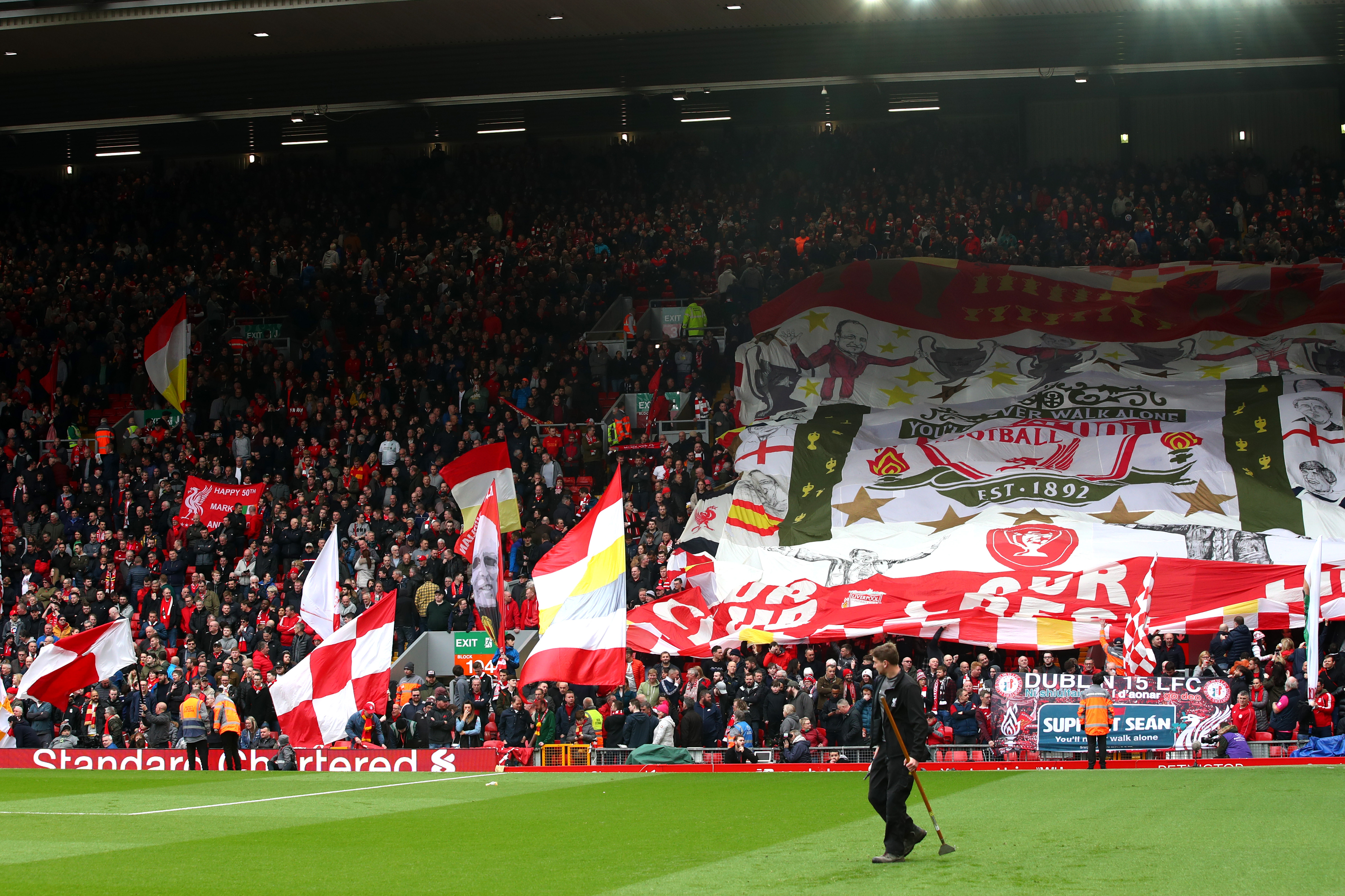 LIVERPOOL, ENGLAND - MARCH 31:  Fans show their support during the Premier League match between Liverpool FC and Tottenham Hotspur at Anfield on March 31, 2019 in Liverpool, United Kingdom. (Photo by Clive Brunskill/Getty Images)