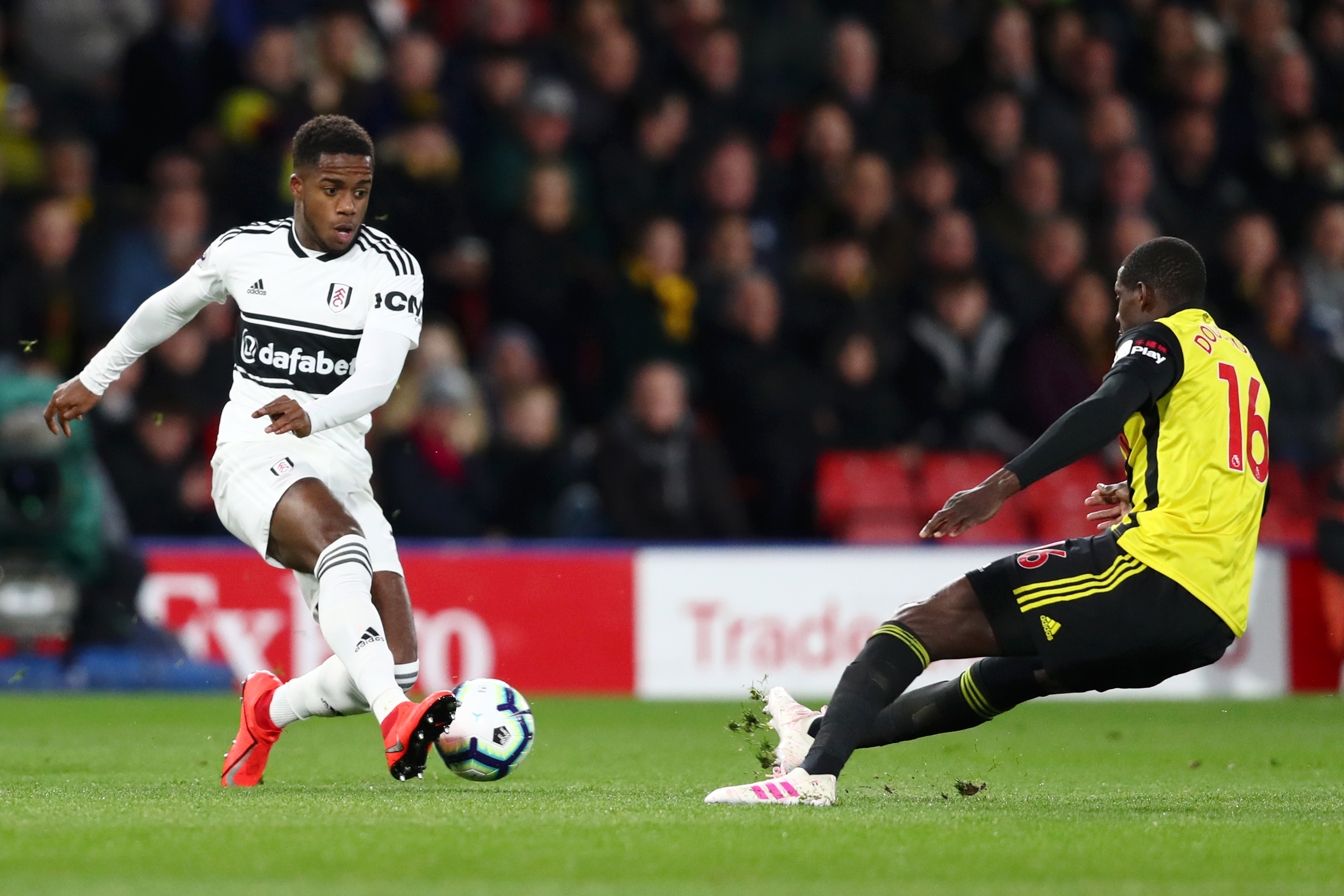 WATFORD, ENGLAND - APRIL 02:  Ryan Sessegnon of Fulham is challenged by Abdoulaye Doucoure of Watford during the Premier League match between Watford FC and Fulham FC at Vicarage Road on April 02, 2019 in Watford, United Kingdom. (Photo by Dan Istitene/Getty Images)