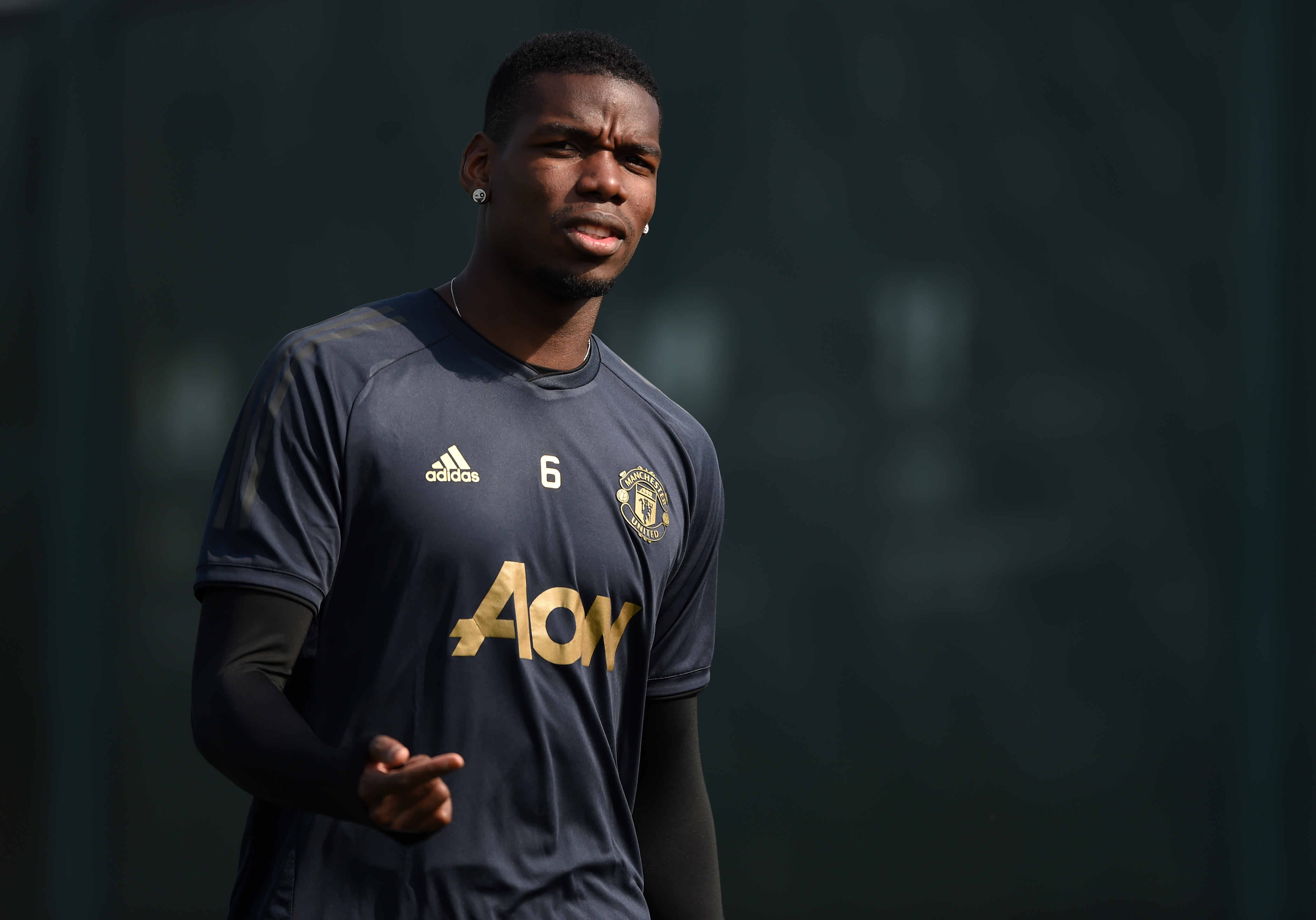 MANCHESTER, ENGLAND - APRIL 09: Paul Pogba of Manchester United walks out to train during the Manchester United training session ahead of the UEFA Champions League Quarter Final First Leg match between Manchester United v FC Barcelona at Aon Training Complex on April 09, 2019 in Manchester, England. (Photo by Nathan Stirk/Getty Images)