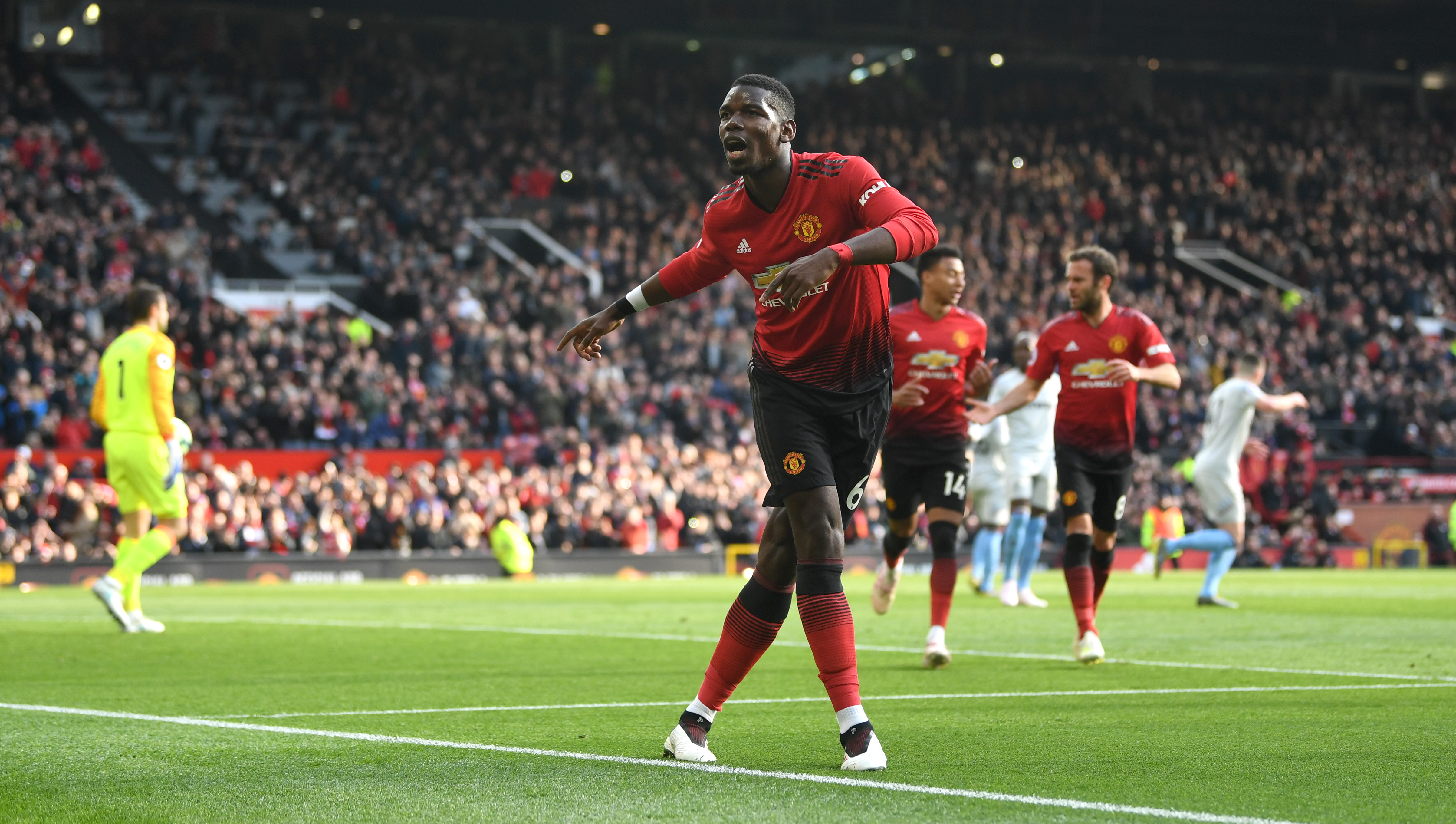 MANCHESTER, ENGLAND - APRIL 13: Paul Pogba of Manchester United celebrates as he scores his team's first goal from the penalty spot during the Premier League match between Manchester United and West Ham United at Old Trafford on April 13, 2019 in Manchester, United Kingdom. (Photo by Gareth Copley/Getty Images)