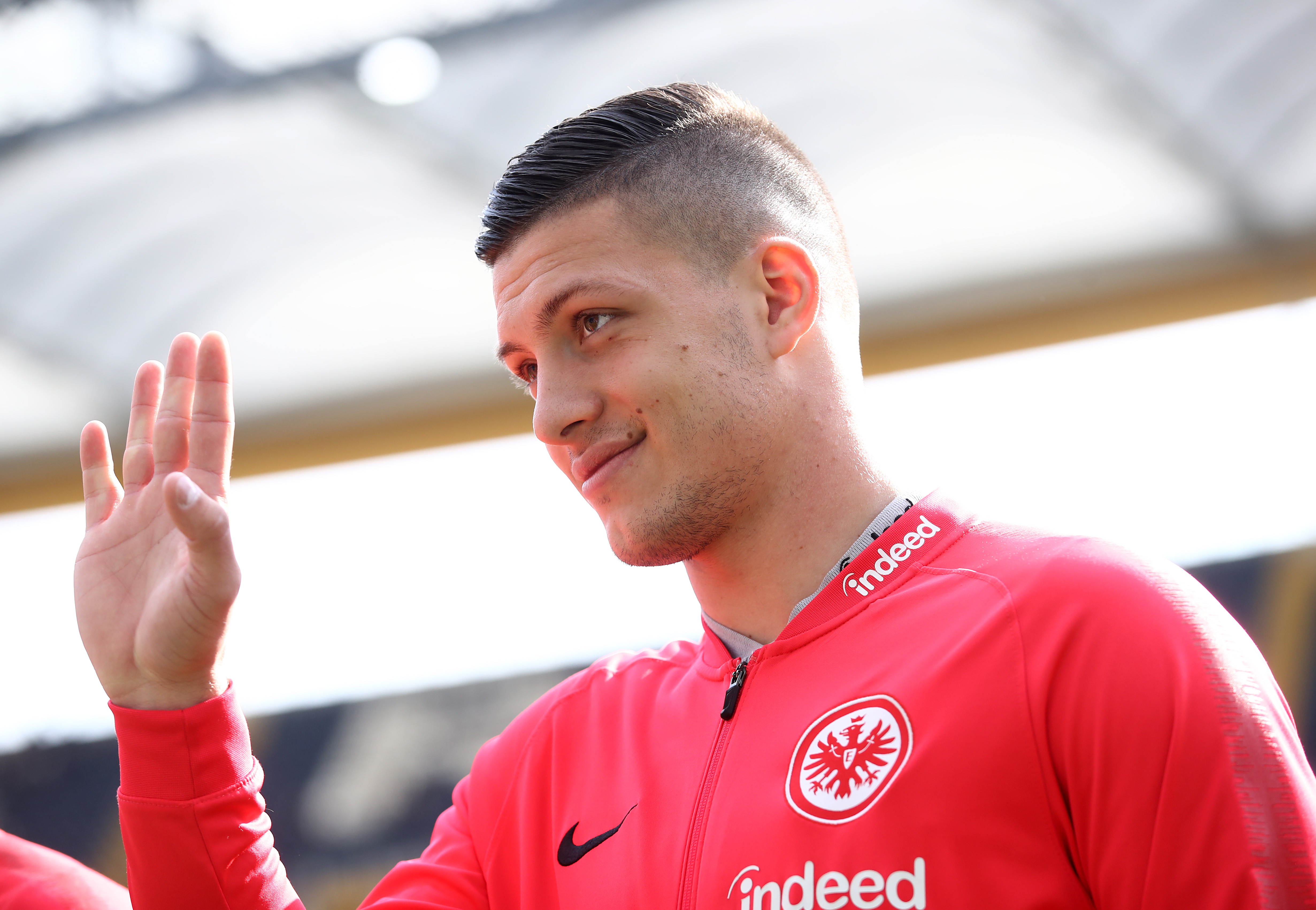 FRANKFURT AM MAIN, GERMANY - APRIL 14: Luka Jovic of Frankfurt waves to fans before the kick off of  the Bundesliga match between Eintracht Frankfurt and FC Augsburg at Commerzbank-Arena on April 14, 2019 in Frankfurt am Main, Germany. (Photo by Alex Grimm/Bongarts/Getty Images)