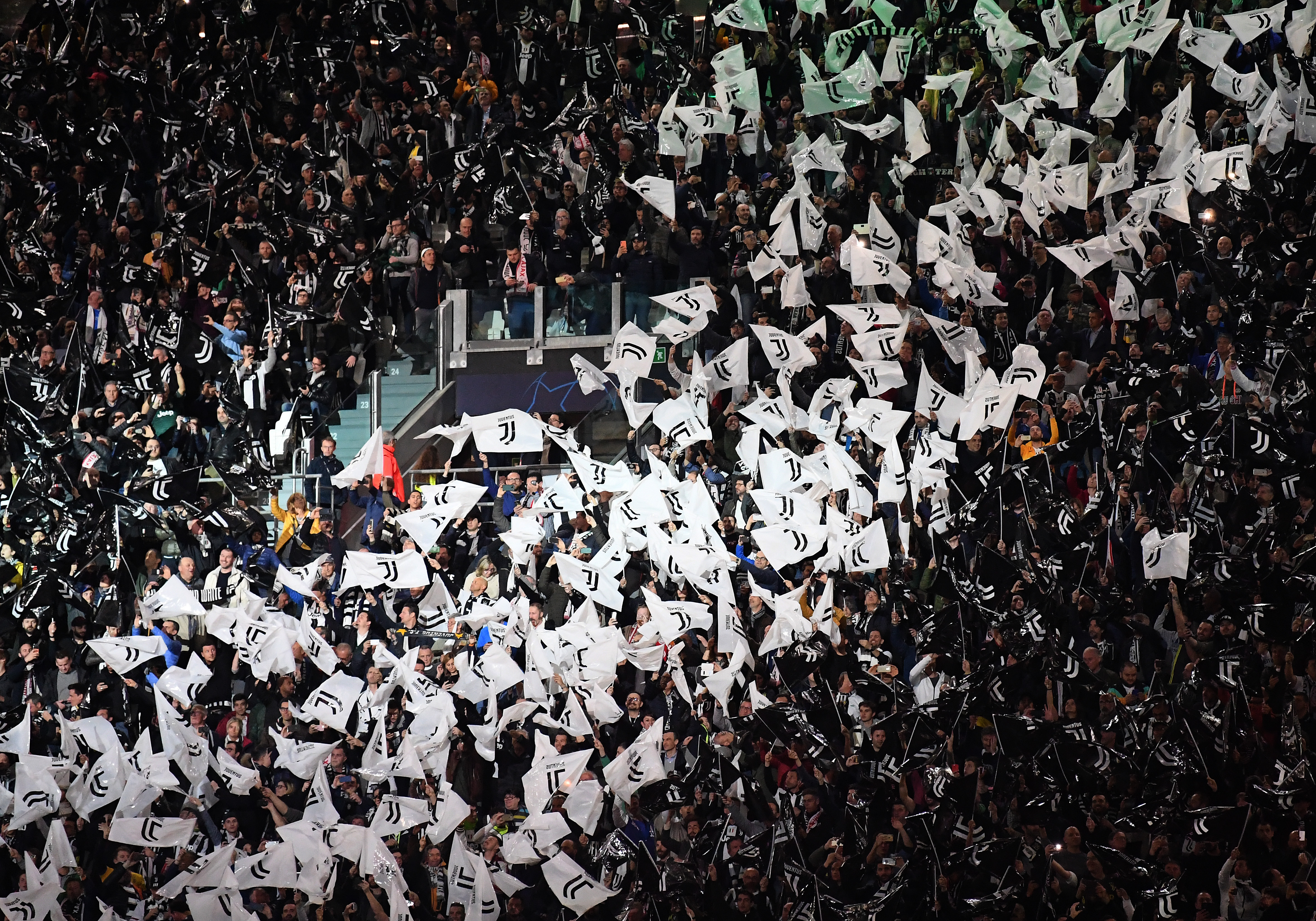 TURIN, ITALY - APRIL 16: Fans of Juventus wave flags during the UEFA Champions League Quarter Final second leg match between Juventus and Ajax at Juventus Stadium on April 16, 2019 in Turin, Italy. (Photo by Stuart Franklin/Getty Images)