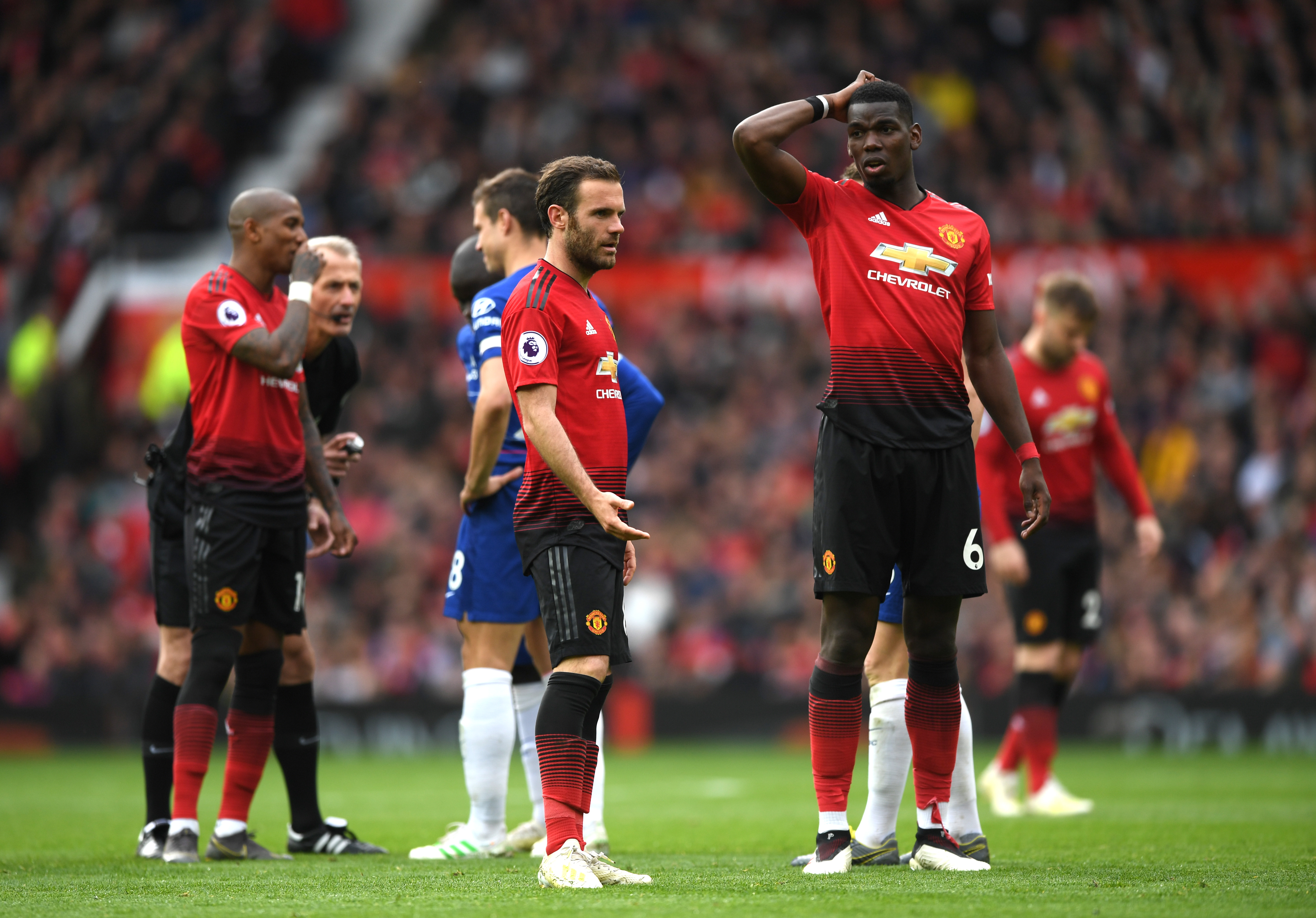 MANCHESTER, ENGLAND - APRIL 28:  Paul Pogba and Juan Mata of Manchester United in discussion during the Premier League match between Manchester United and Chelsea FC at Old Trafford on April 28, 2019 in Manchester, United Kingdom. (Photo by Shaun Botterill/Getty Images)