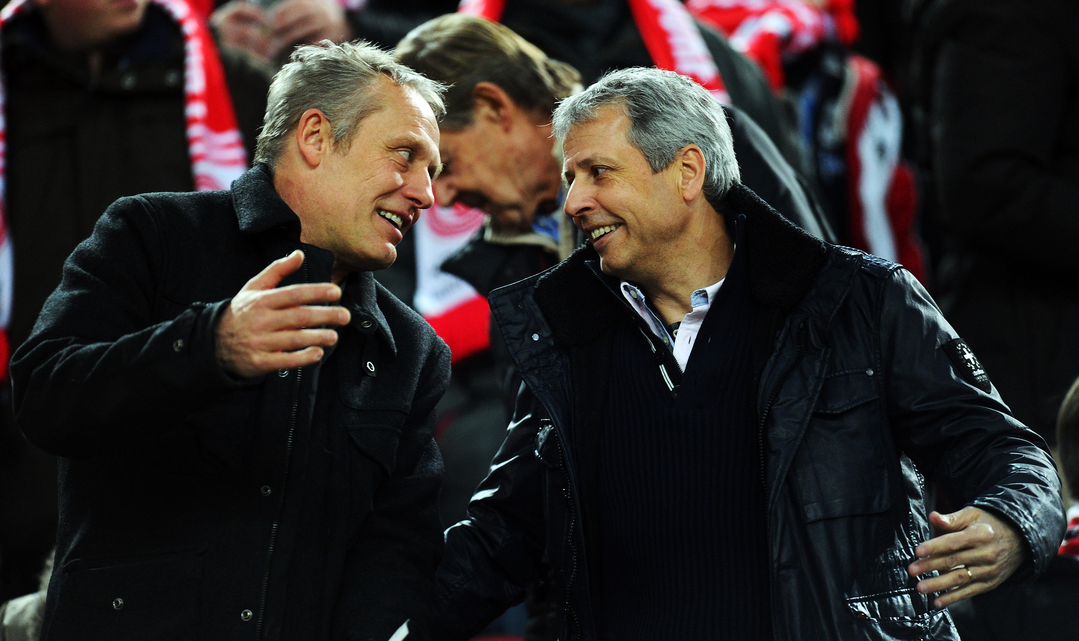 DUESSELDORF, GERMANY - JANUARY 20: Christian Streich, head coach of SC Freiburg, speaks with Lucien Favre, head coach of Borussia Moenchengladbach, during the Bundesliga match between Fortuna Duesseldorf 1895 and FC Augsburg at Esprit-Arena on January 20, 2013 in Duesseldorf, Germany.  (Photo by Lars Baron/Bongarts/Getty Images)