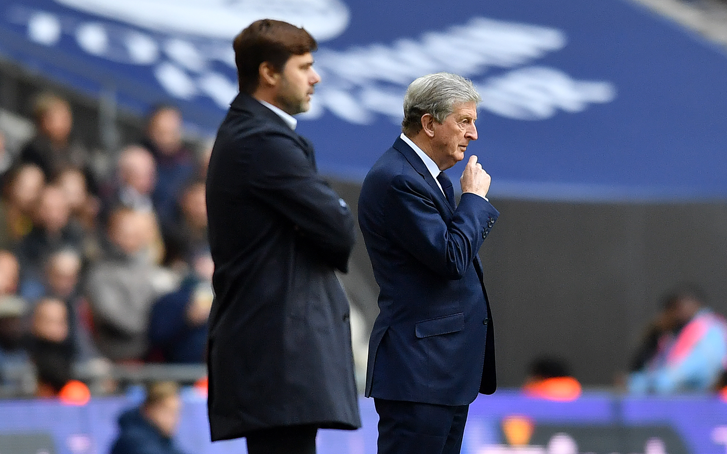 Tottenham Hotspur's Argentinian head coach Mauricio Pochettino and Crystal Palace's English manager Roy Hodgson watches his players from the touchline during the English Premier League football match between Tottenham Hotspur and Crystal Palace at Wembley Stadium in London, on November 5, 2017. / AFP PHOTO / Ben STANSALL / RESTRICTED TO EDITORIAL USE. No use with unauthorized audio, video, data, fixture lists, club/league logos or 'live' services. Online in-match use limited to 75 images, no video emulation. No use in betting, games or single club/league/player publications.  /         (Photo credit should read BEN STANSALL/AFP/Getty Images)