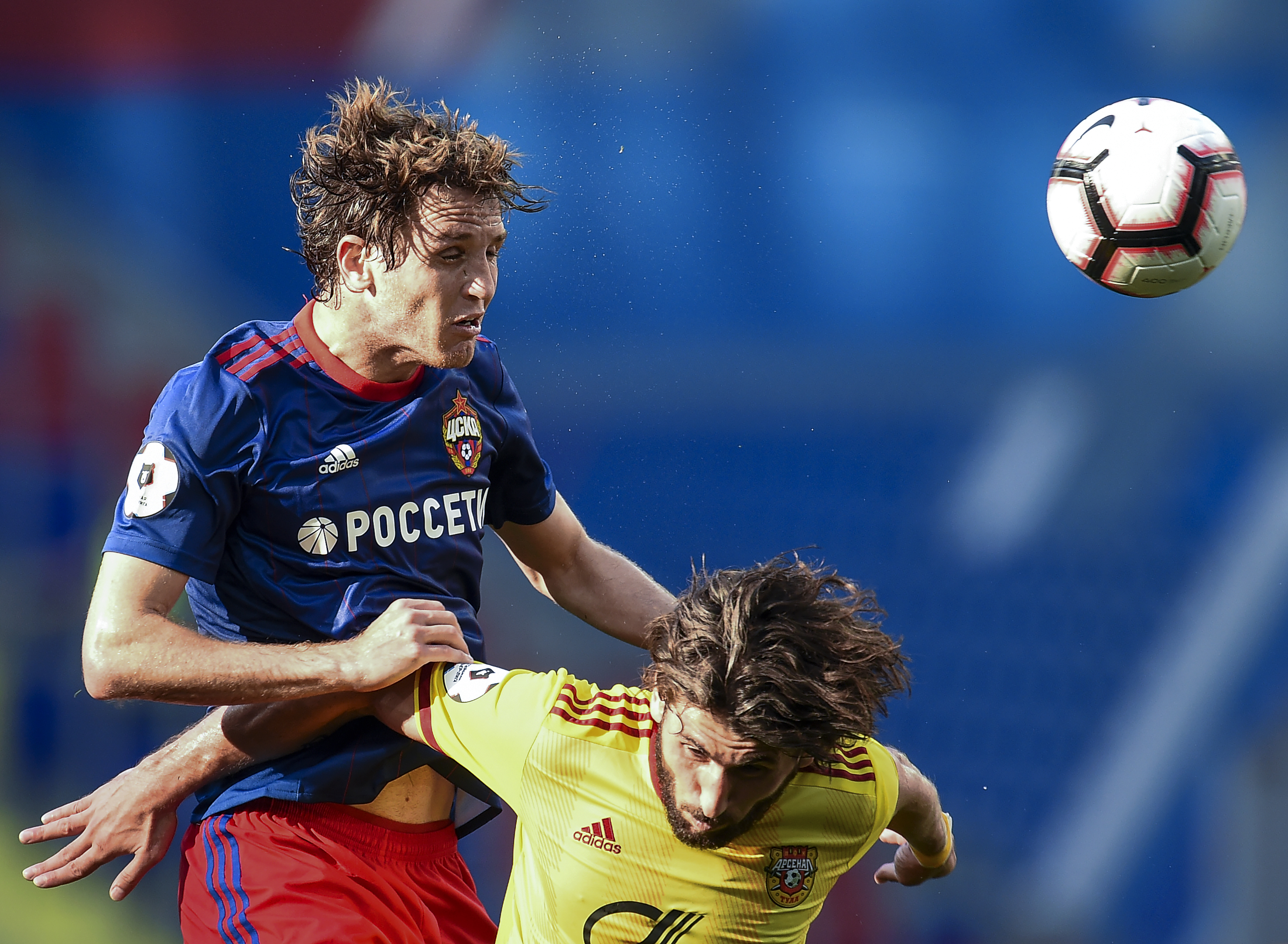 MOSCOW, RUSSIA - AUGUST 18: Mario Fernandes (L) of PFC CSKA Moscow is challenged by Anri Khagush of FC Arsenal Tula during the Russian Premier League match between PFC CSKA Moscow and FC Arsenal Tula at the VEB Arena Stadium on August 18, 2018 in Moscow, Russia. (Photo by Epsilon/Getty Images)