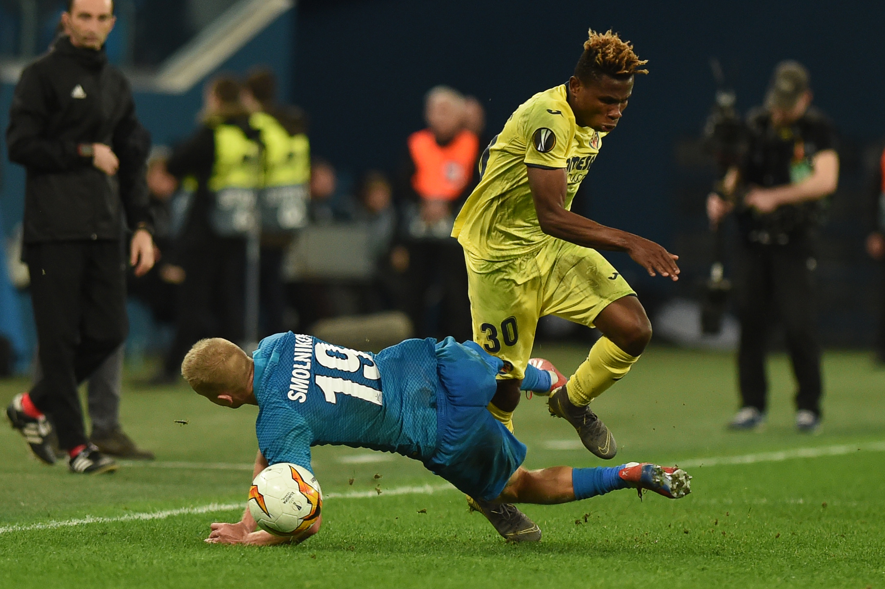 Zenit St. Petersburg's Russian defender Igor Smolnikov and Villarreal's Nigerian midfielder Samuel Chukwueze vie for the ball during the Europa League round of 16 first leg football match between FC Zenit and Villarreal CF in Saint Petersburg on March 7, 2019. (Photo by Olga MALTSEVA / AFP)        (Photo credit should read OLGA MALTSEVA/AFP/Getty Images)