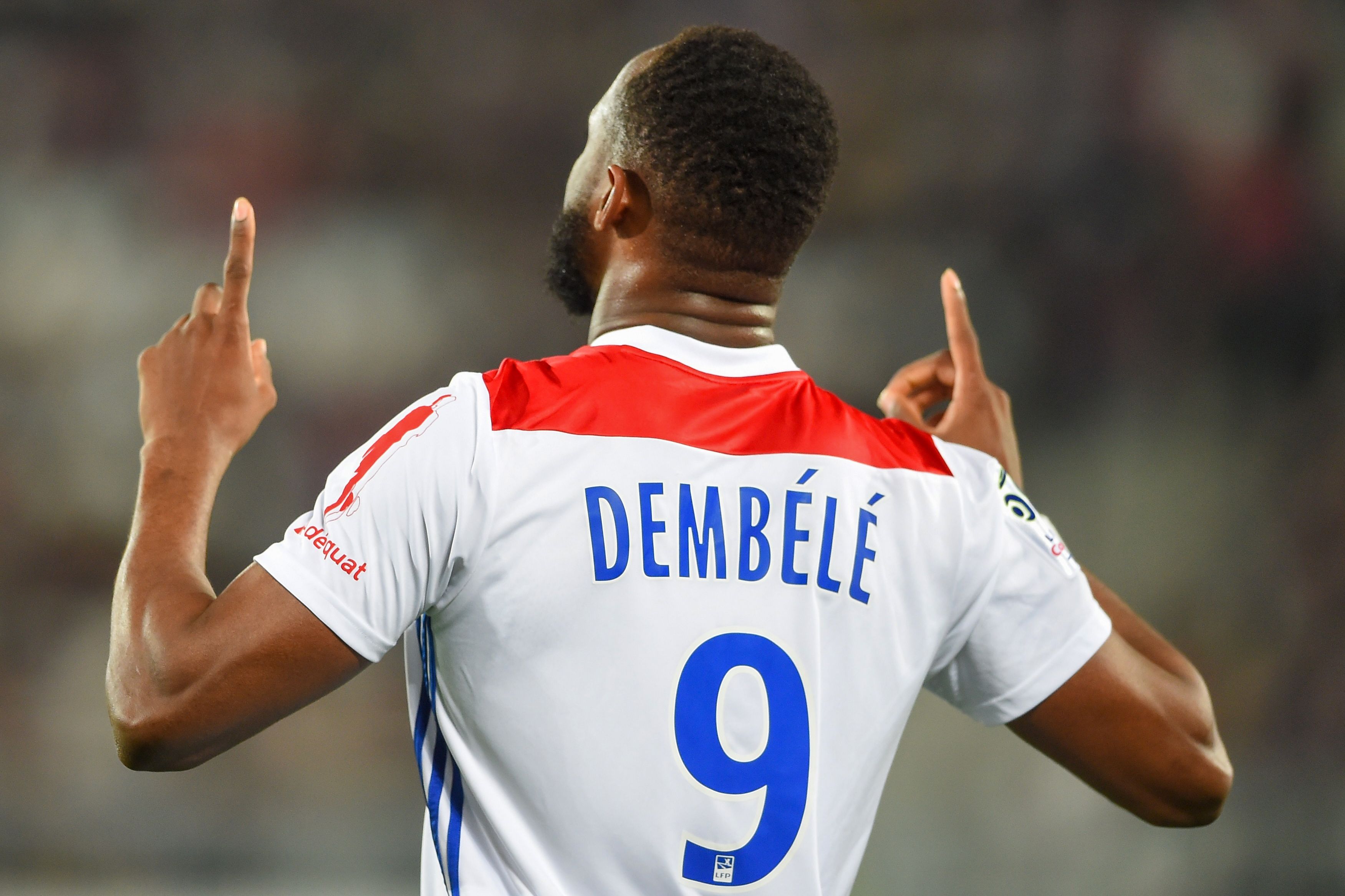 Lyon's French forward Moussa Dembele gestures after scoring a goal during the French L1 football match between Bordeaux (FCGB) and Lyon (OL) on April 26, 2019 at the Matmut Atlantique stadium in Bordeaux, southwestern France. (Photo by NICOLAS TUCAT / AFP)        (Photo credit should read NICOLAS TUCAT/AFP/Getty Images)