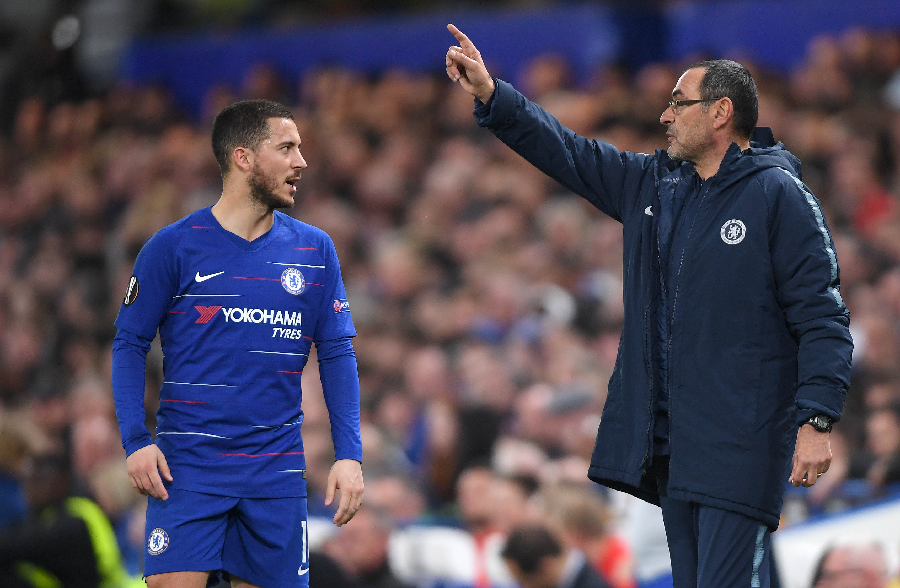 LONDON, ENGLAND - APRIL 18: Maurizio Sarri, Manager of Chelsea speaks with Eden Hazard of Chelsea  during the UEFA Europa League Quarter Final Second Leg match between Chelsea and Slavia Praha at Stamford Bridge on April 18, 2019 in London, England. (Photo by Mike Hewitt/Getty Images)