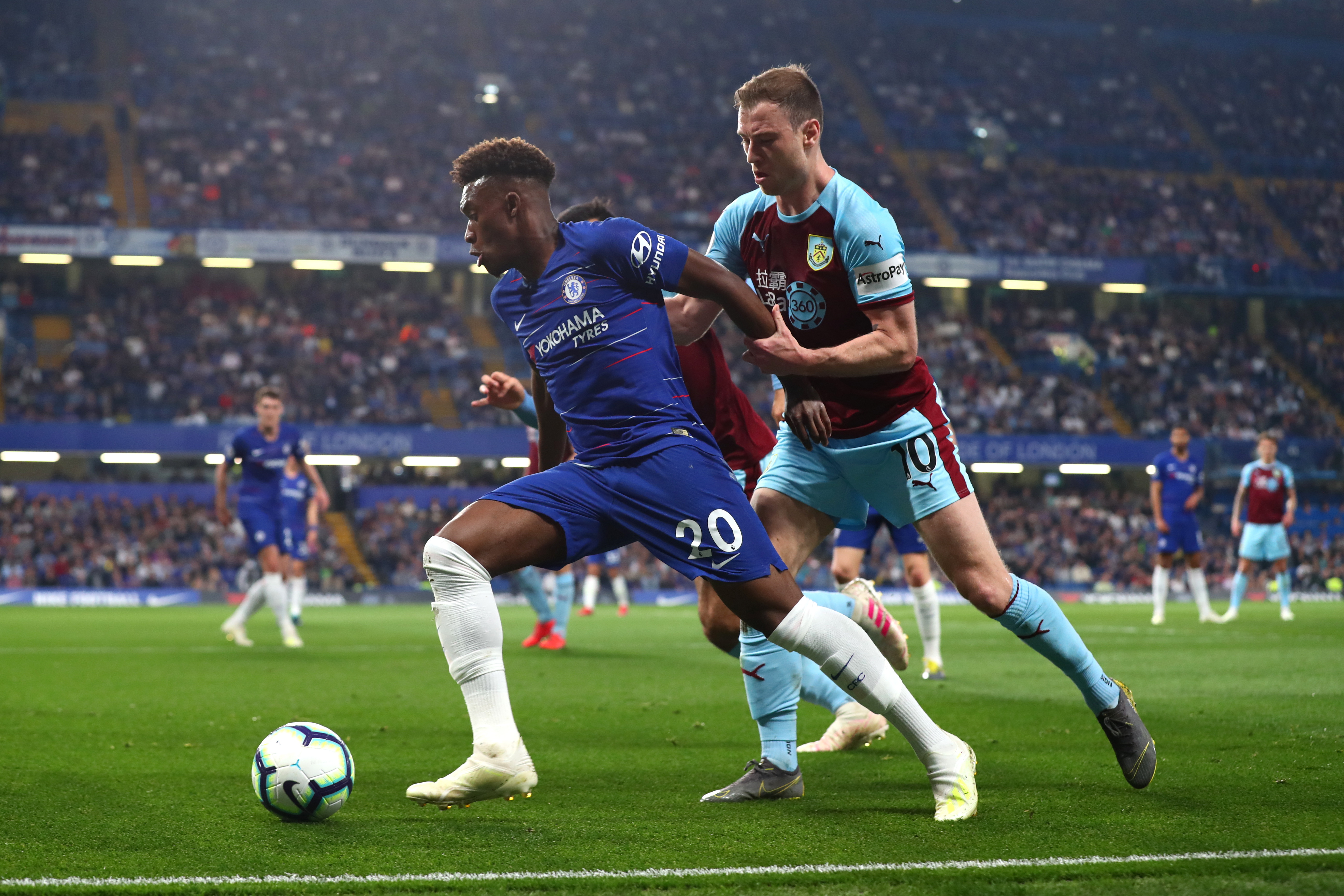 LONDON, ENGLAND - APRIL 22: Callum Hudson-Odoi of Chelsea holds off Ashley Barnes of Burnley during the Premier League match between Chelsea FC and Burnley FC at Stamford Bridge on April 22, 2019 in London, United Kingdom. (Photo by Clive Rose/Getty Images)