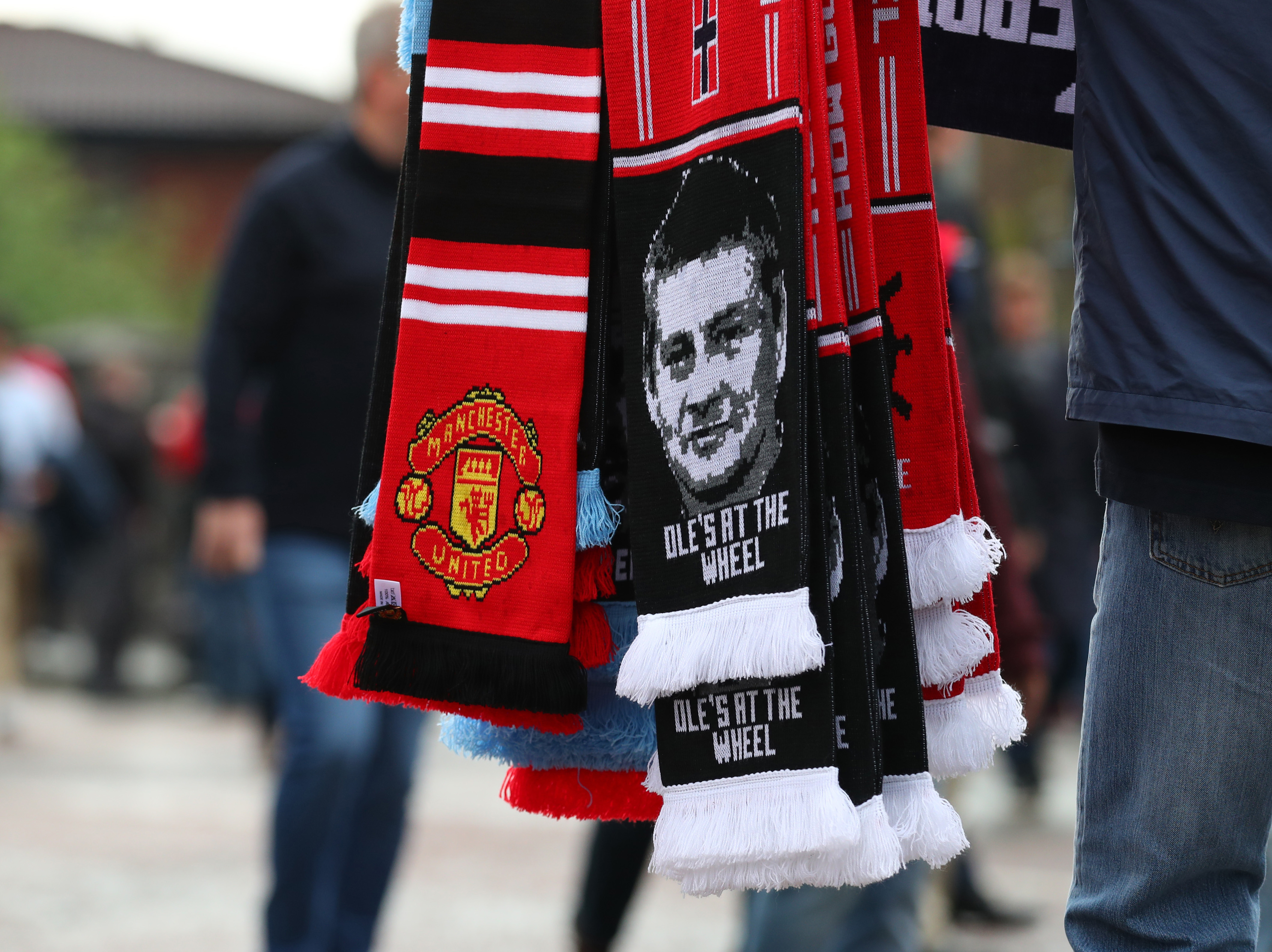 MANCHESTER, ENGLAND - APRIL 24: A Manchester United scarf with an image of Ole Gunnar Solskjaer manager of Manchester United ahead of the Premier League match between Manchester United and Manchester City at Old Trafford on April 24, 2019 in Manchester, United Kingdom. (Photo by Catherine Ivill/Getty Images)