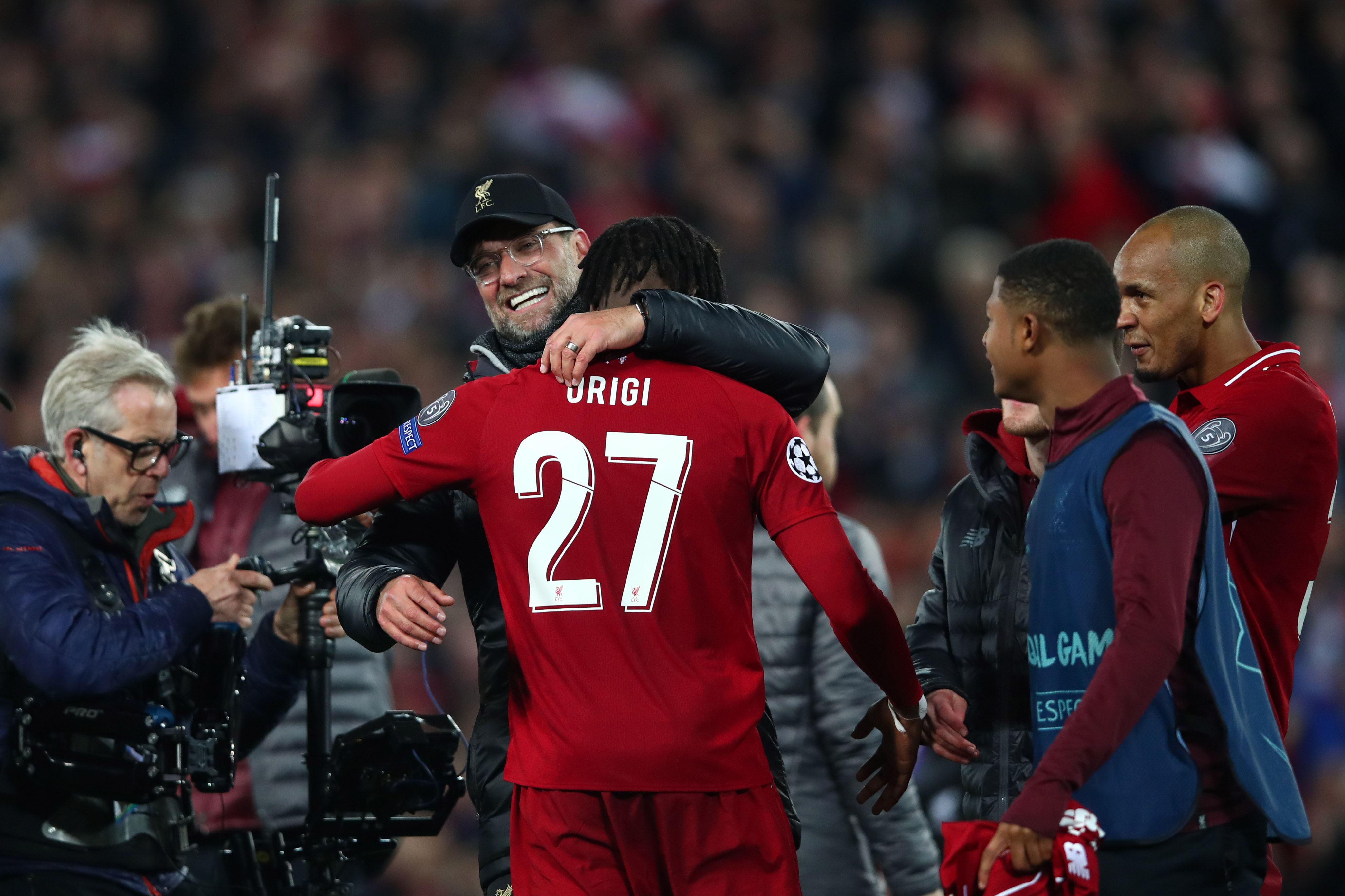LIVERPOOL, ENGLAND - MAY 07:  Jurgen Klopp, Manager of Liverpool and Divock Origi celebrate after the UEFA Champions League Semi Final second leg match between Liverpool and Barcelona at Anfield on May 07, 2019 in Liverpool, England. (Photo by Clive Brunskill/Getty Images)