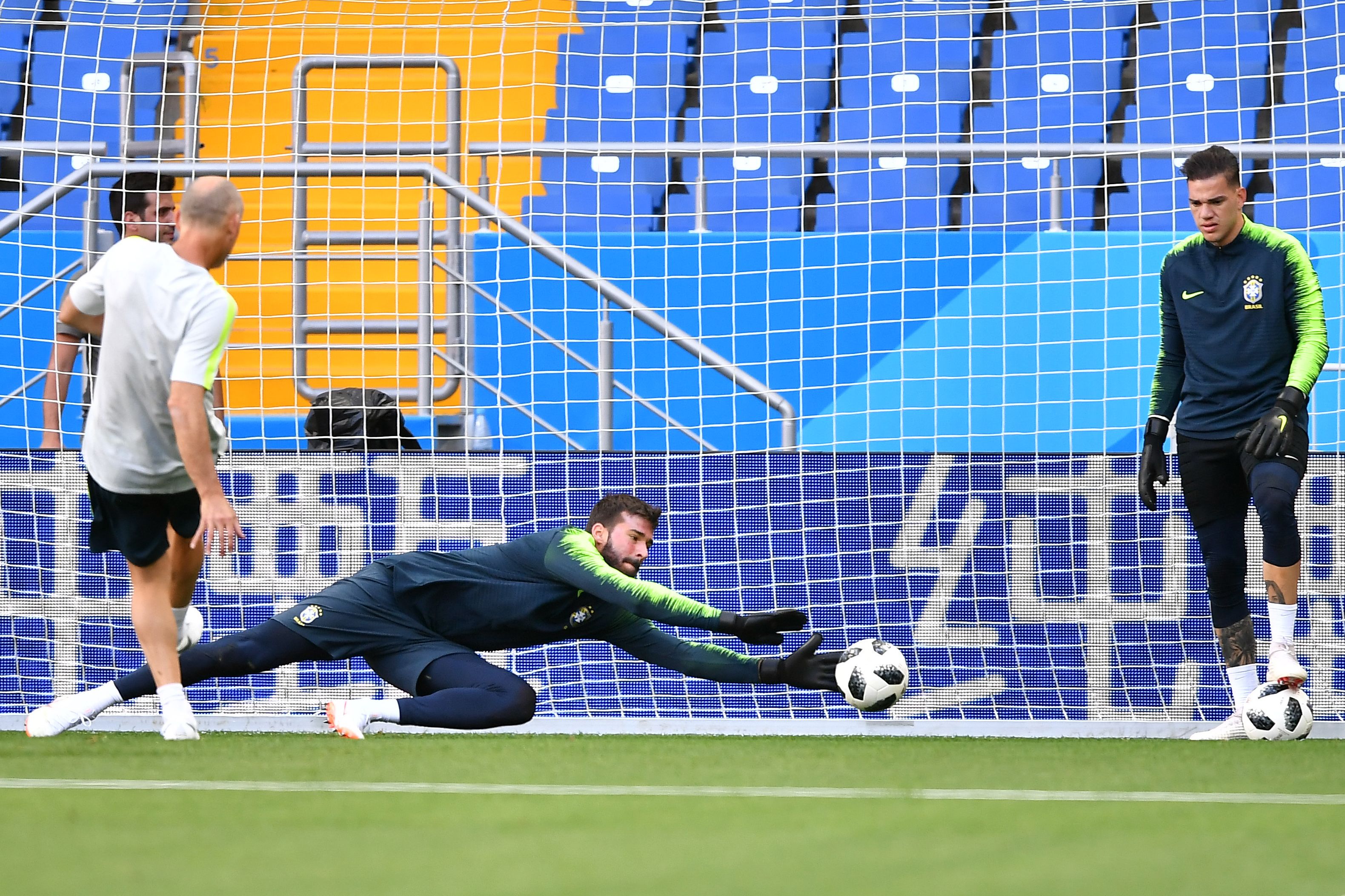Brazil's goalkeeper Alisson (C) and Brazil's goalkeeper Ederson (R) take part in a training session at the Rostov Arena in Rostov-on-Don on June 16, 2018 on the eve of the Russia 2018 World Cup Group E football match between Brazil and Switzerland. (Photo by JOE KLAMAR / AFP)        (Photo credit should read JOE KLAMAR/AFP/Getty Images)
